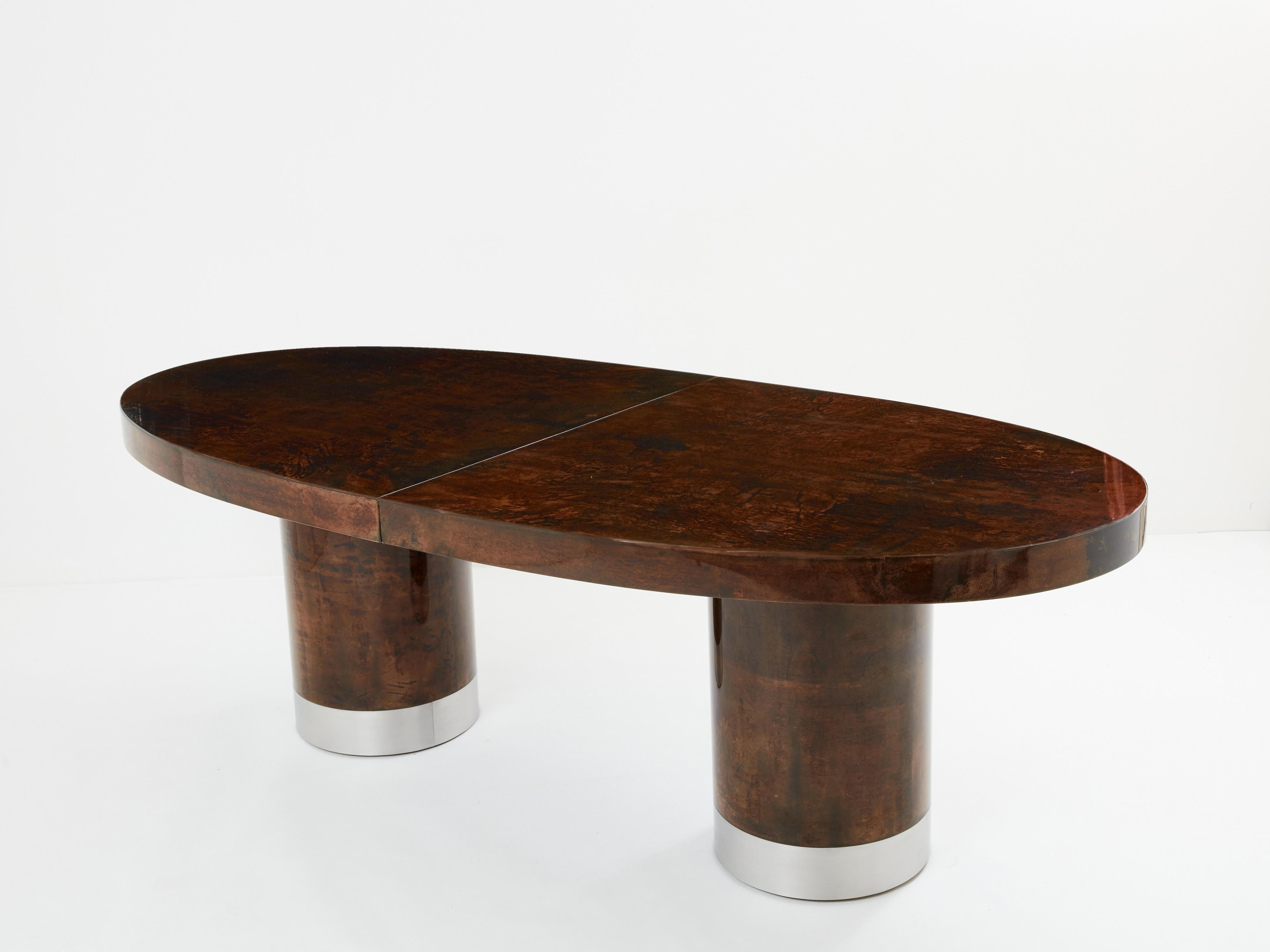 This unique Aldo Tura dining table was produced in Italy in the late 1960s, and really feels imposing and glamorous. The lacquered goatskin parchment, in rich shades of brown and dark brown, makes this dining table typical of designer Aldo Tura