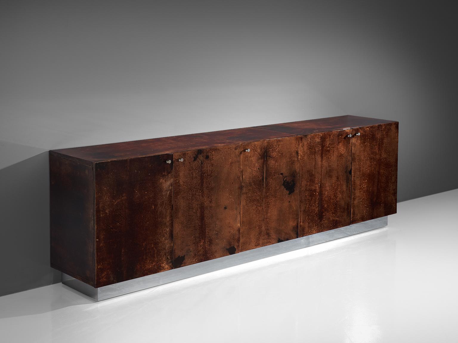 Aldo Tura, large sideboard, lacquered goatskin, wood and aluminium, Italy, circa 1970.

Very large sideboard by Aldo Tura. The lacquered goat skin shows a beautiful range of deep brown tones and provides a stunning contrast with the aluminum