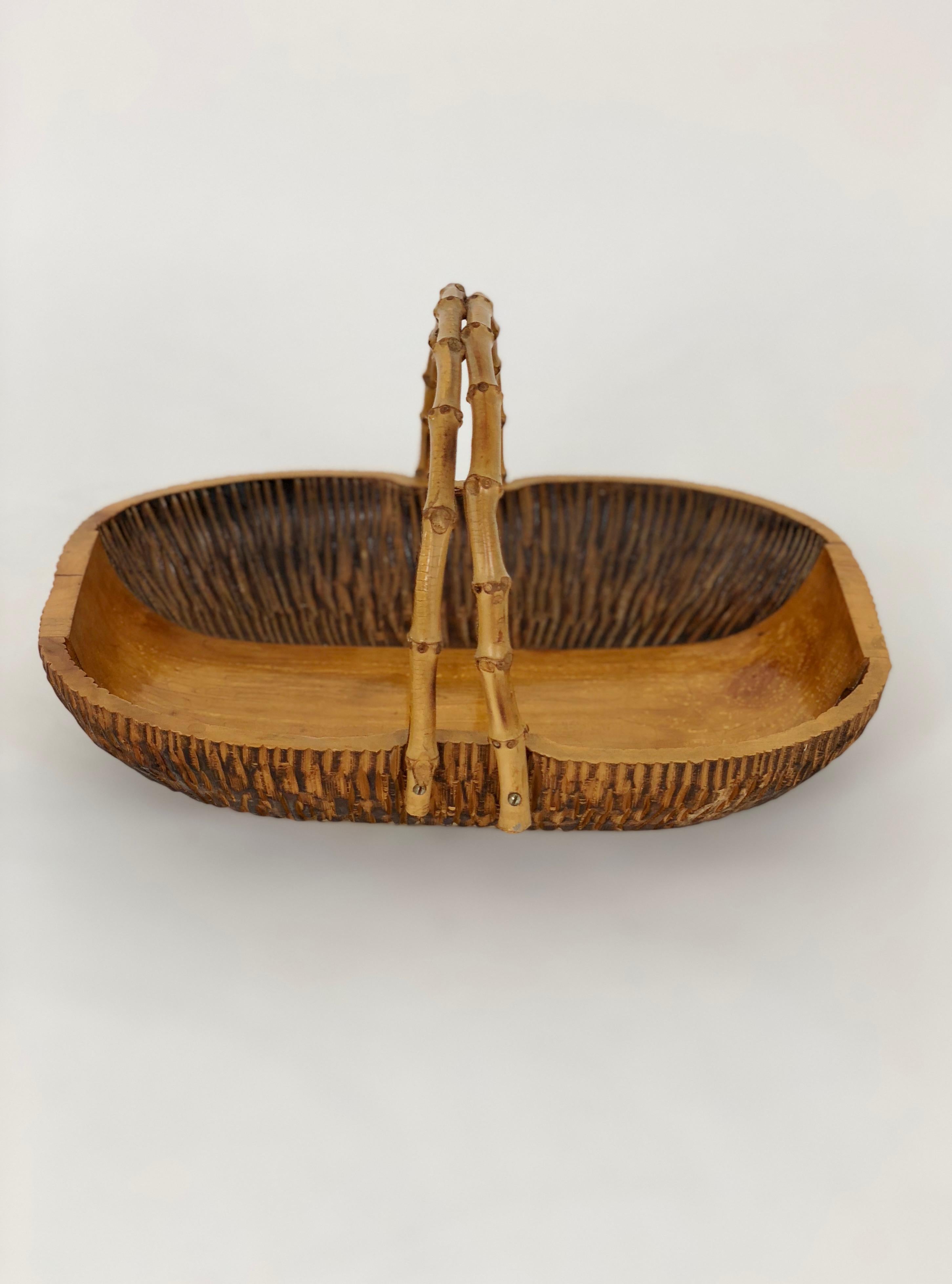Aldo Tura for Macabo fruit walnut bowl centrepiece hand carved wood and bamboo handles, Italy, 1950s. 

The original stamp is on the bottom.
