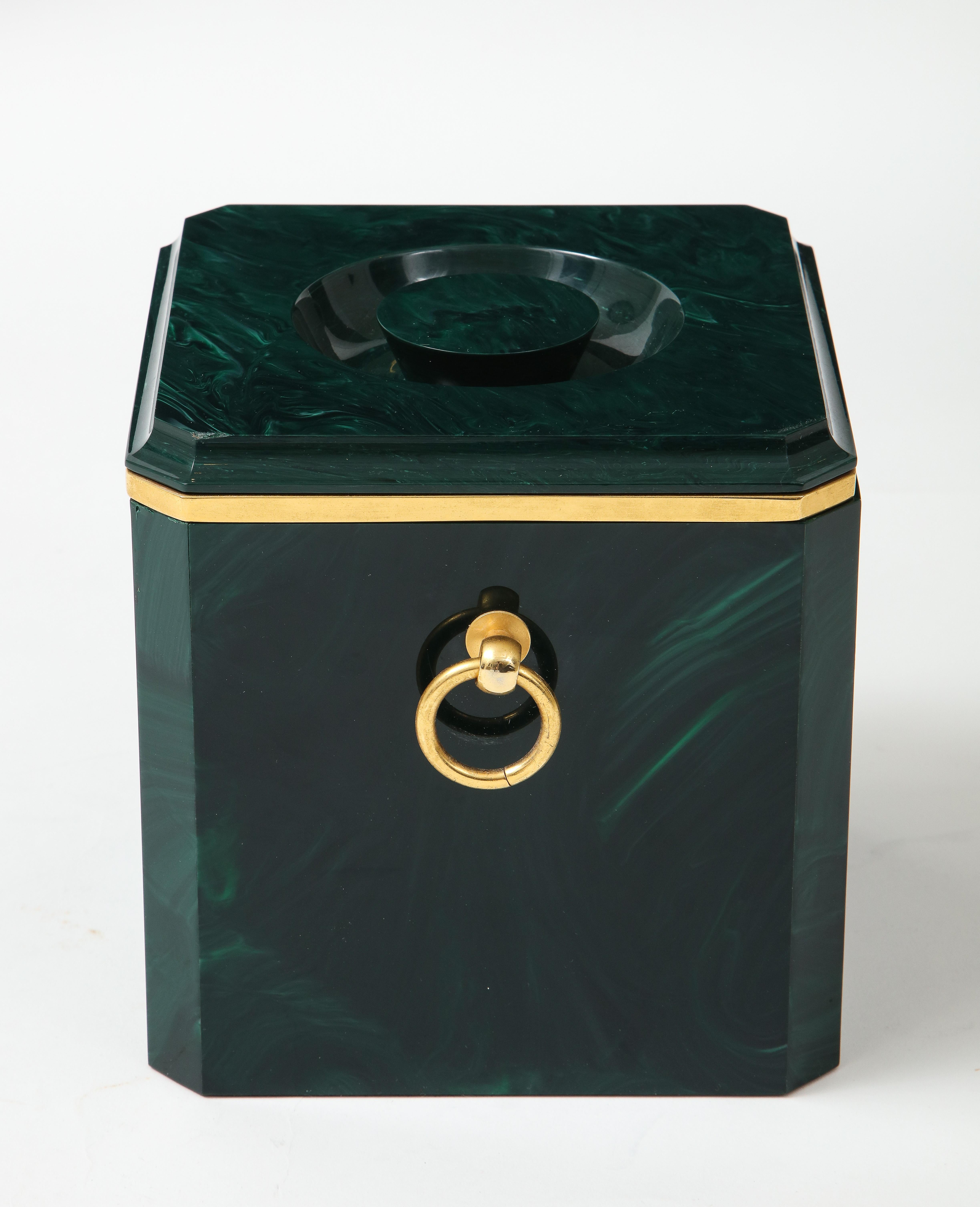 Aldo Tura faux malachite ice bucket with brass rings and brass rim detail under lid, Italy, 1970s. This stylish malachite ice bucket is well-made with wonderful features throughout including the beveled edges and brass details.