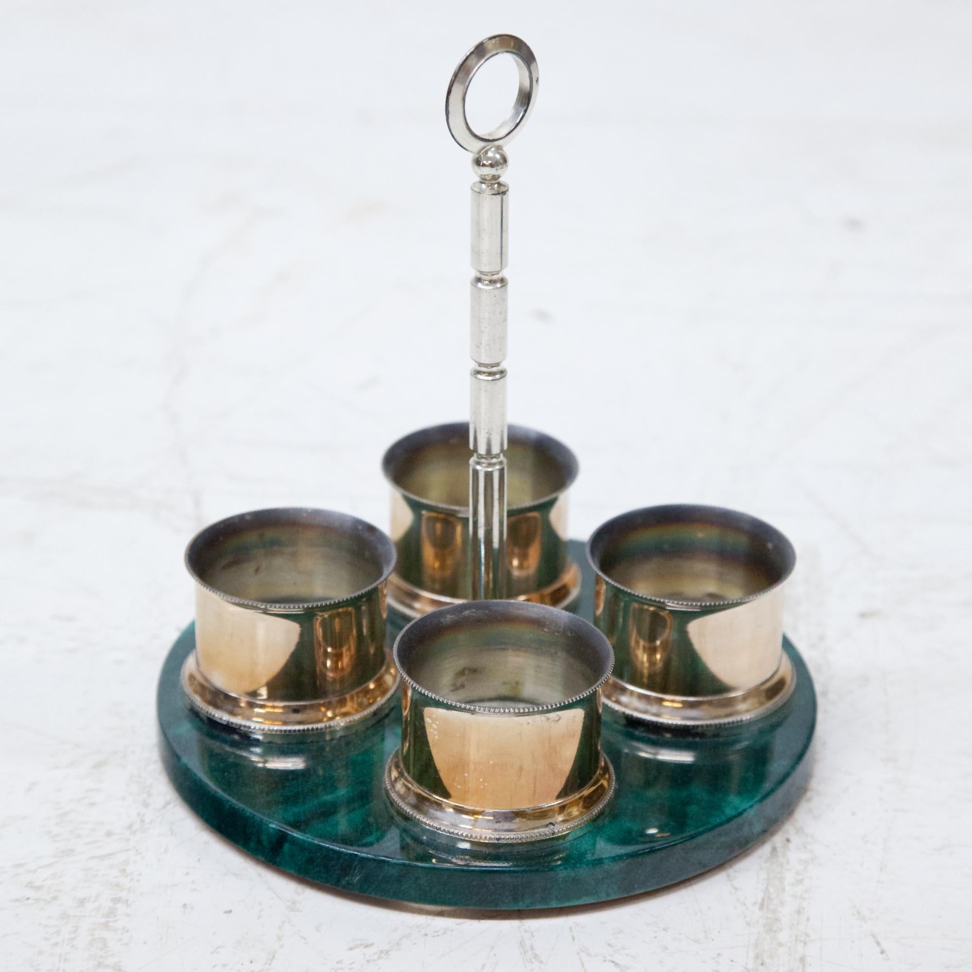 Menagerie covered with green colored goatskin and clear varnish. Space for four bottles. Brass plated. Base label 