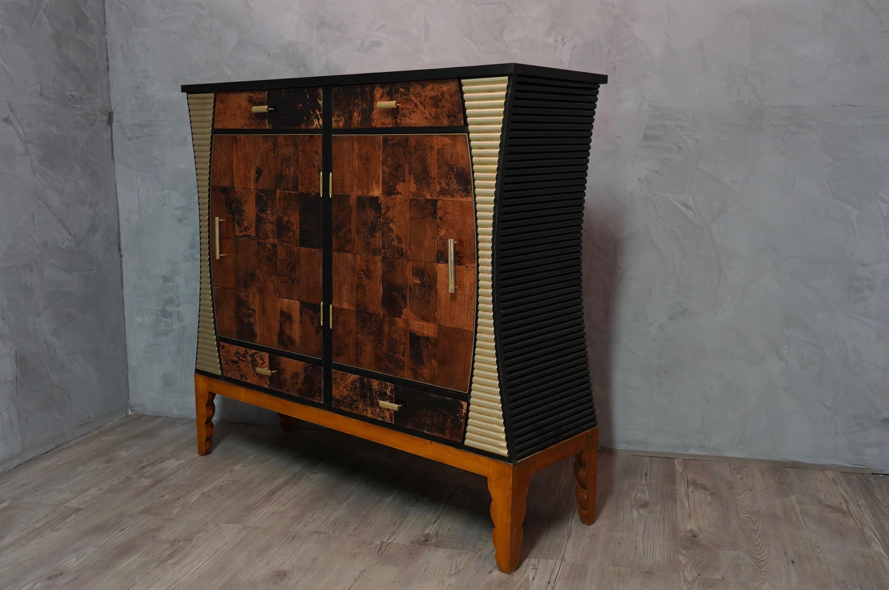 Amazing design for a truly unique sideboards with goatskin doors and beautiful polished brass inserts. Original piece from the mid-20th century. Composed of fine materials that perfectly match each other, this dining room furniture by Aldo