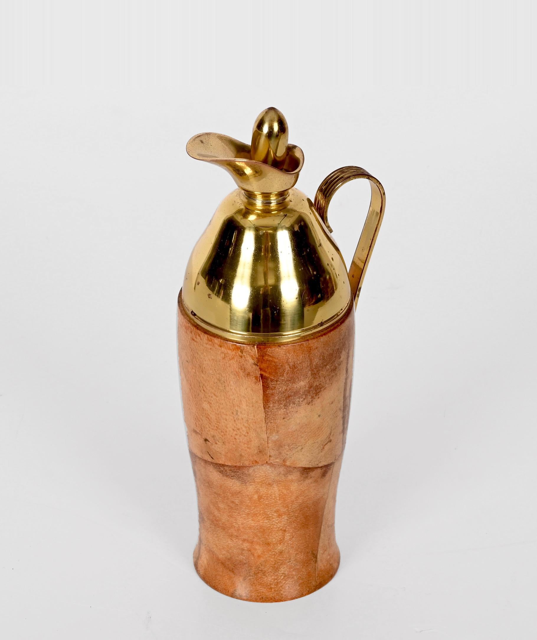 Amazing wooden goatskin thermos decanter with mid-century gilt brass trim. Aldo Tura produced this wonderful item in Milan, Italy, during the 1950s for a Macabo production.

The piece shows fantastic craftsmanship as the outer and insulating