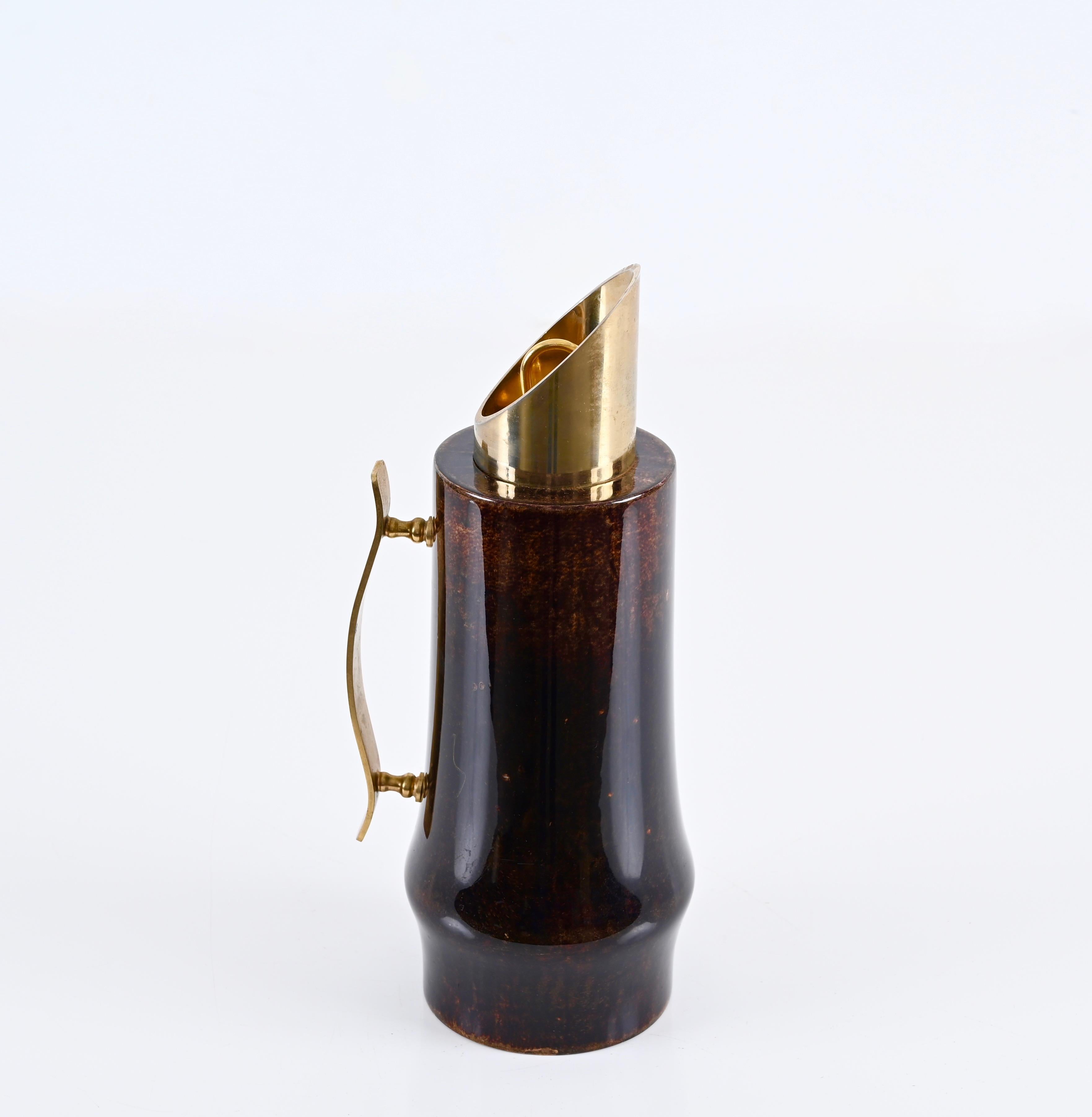 Stunning vitrified goatskin thermos decanter with gilt brass trim. Aldo Tura designed this wonderful item in Milan, Italy, during the 1950s for a Macabo production.

The piece shows fantastic craftsmanship as the inner and insulating element is