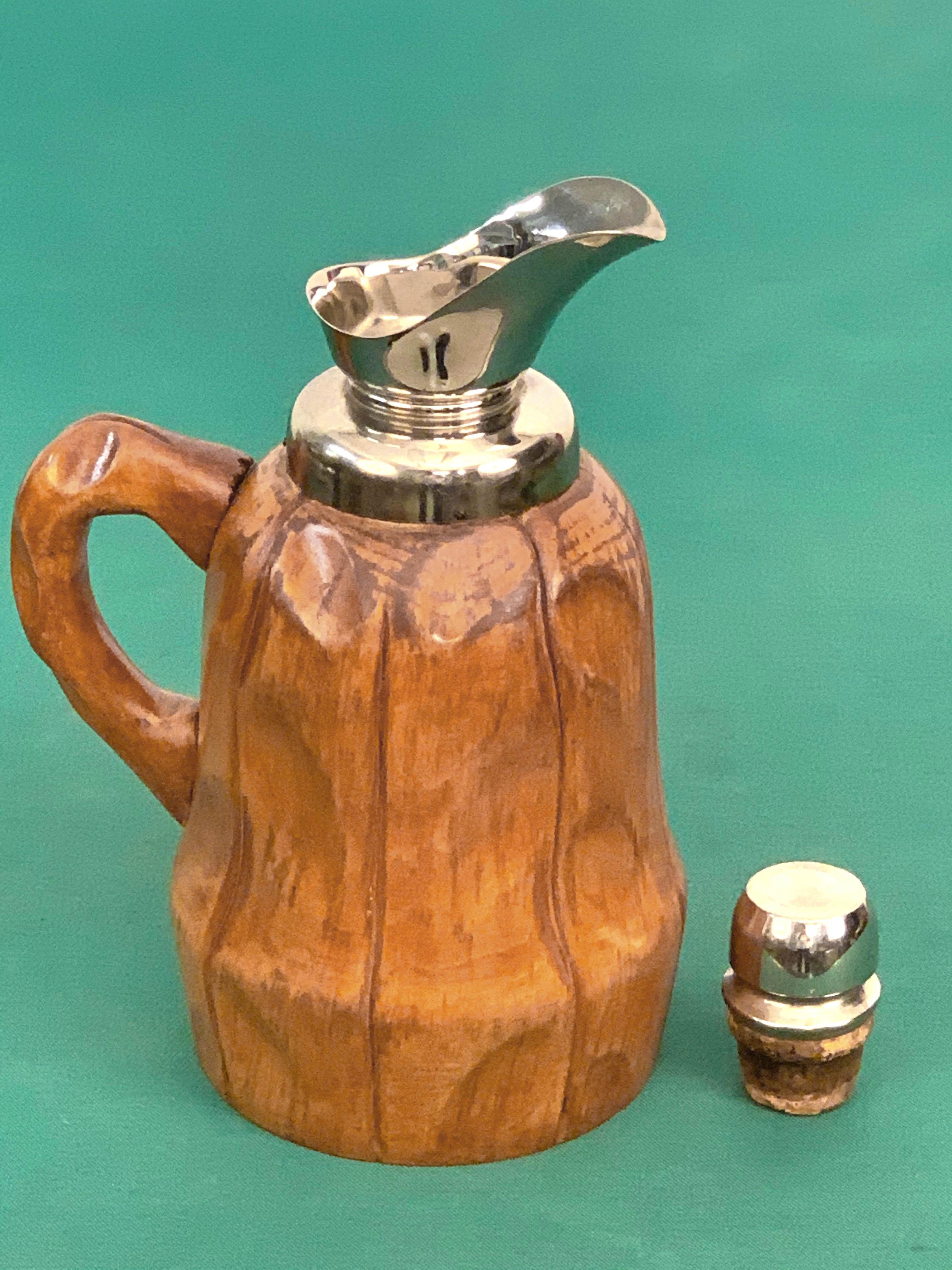 Amazing midcentury walnut wood thermos decanter. This wonderful item was produced in Milan, Italy, during 1950s by Aldo Tura for Macabo.

The following piece is fantastic as the external and isolating part is made of hand carved walnut wood with