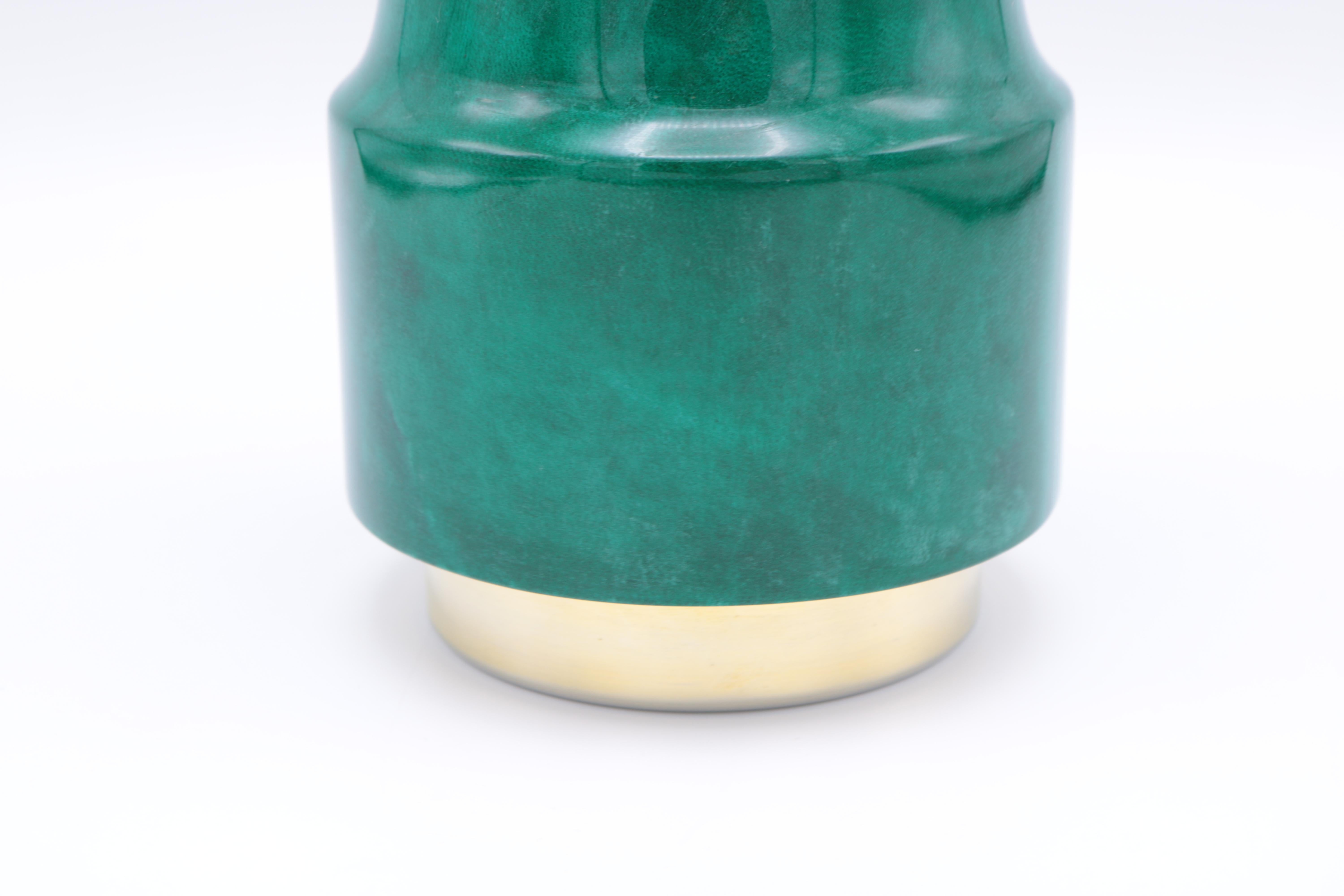 An Aldo Tura Modernist cocktail shaker. 
Green colored parchment with silver and brass plated details.