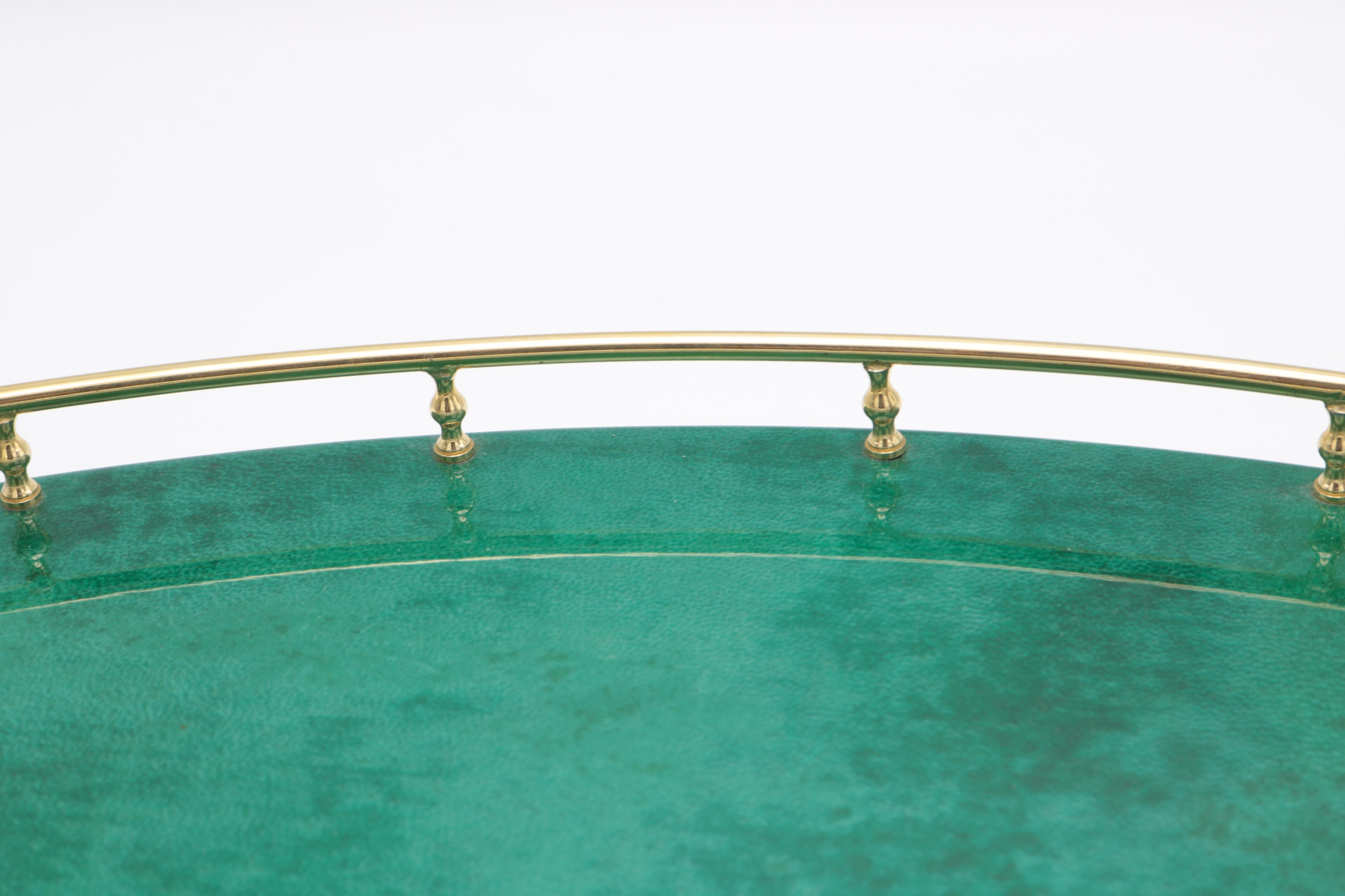 An Aldo Tura modernist tray.
Green colored parchment with brass handles and details.
         