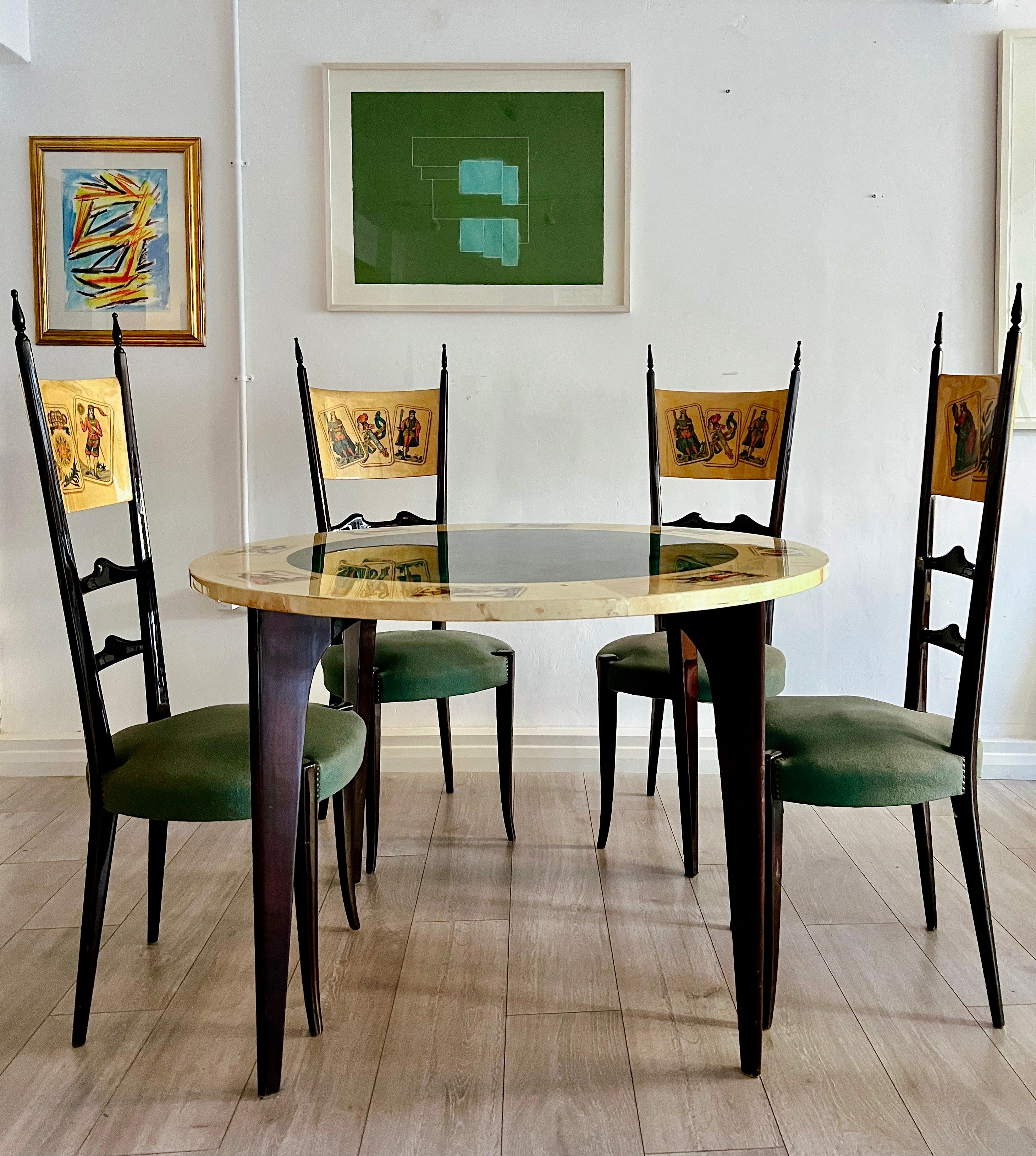 An exceptional suite of furniture designed by the master of parchment, Aldo Tura in the late 1950s. The table, veneered in Vellum has been stencilled and then hand painted depicting eight different Neapolitan playing cards. The inner circle explores
