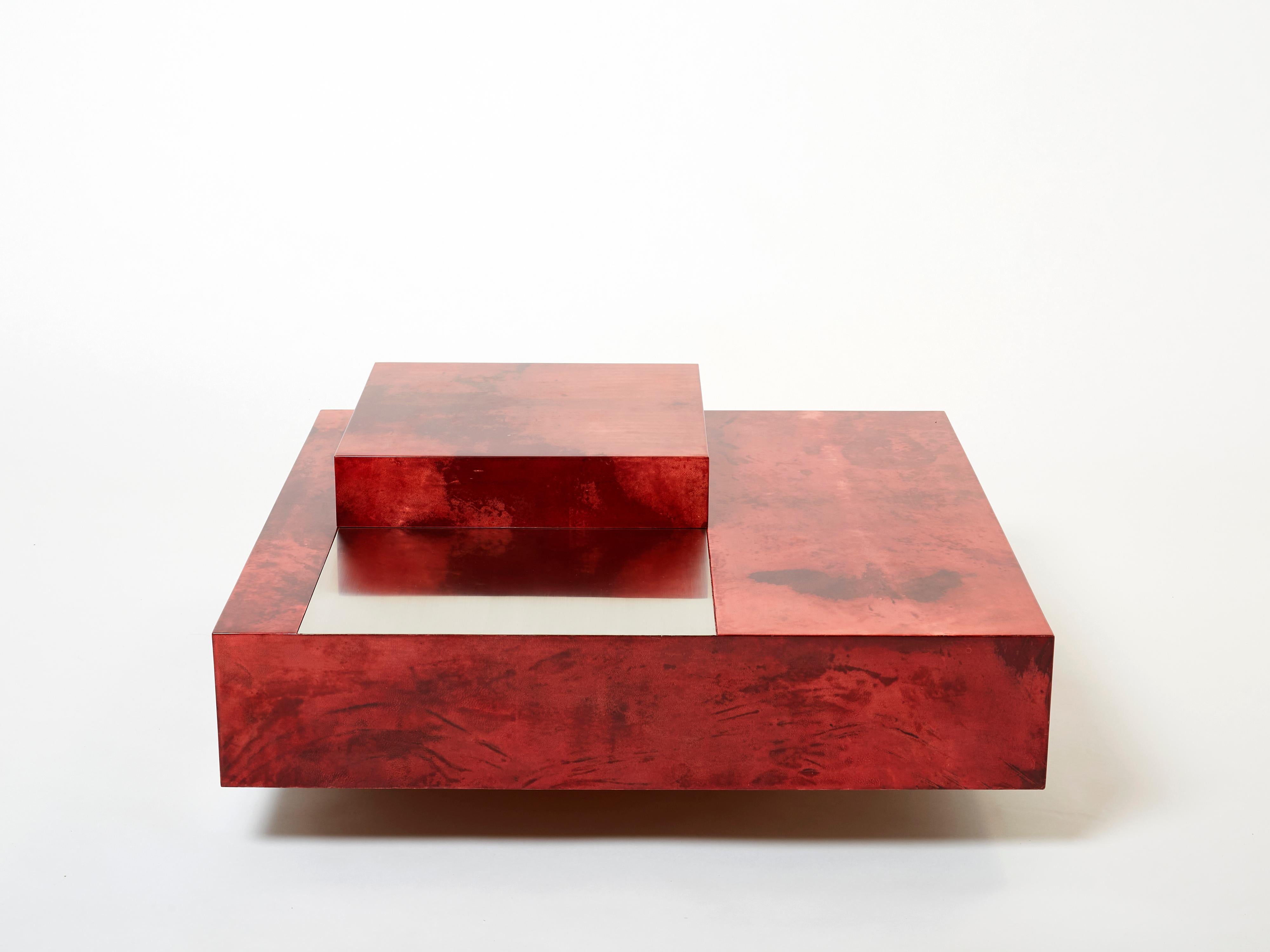 The varnished goatskin parchment, in rich shades of light cherry red, makes this coffee table typical of designer Aldo Tura. This large square piece would make a fascinating centerpiece for any living room. It’s been beautifully finished for a