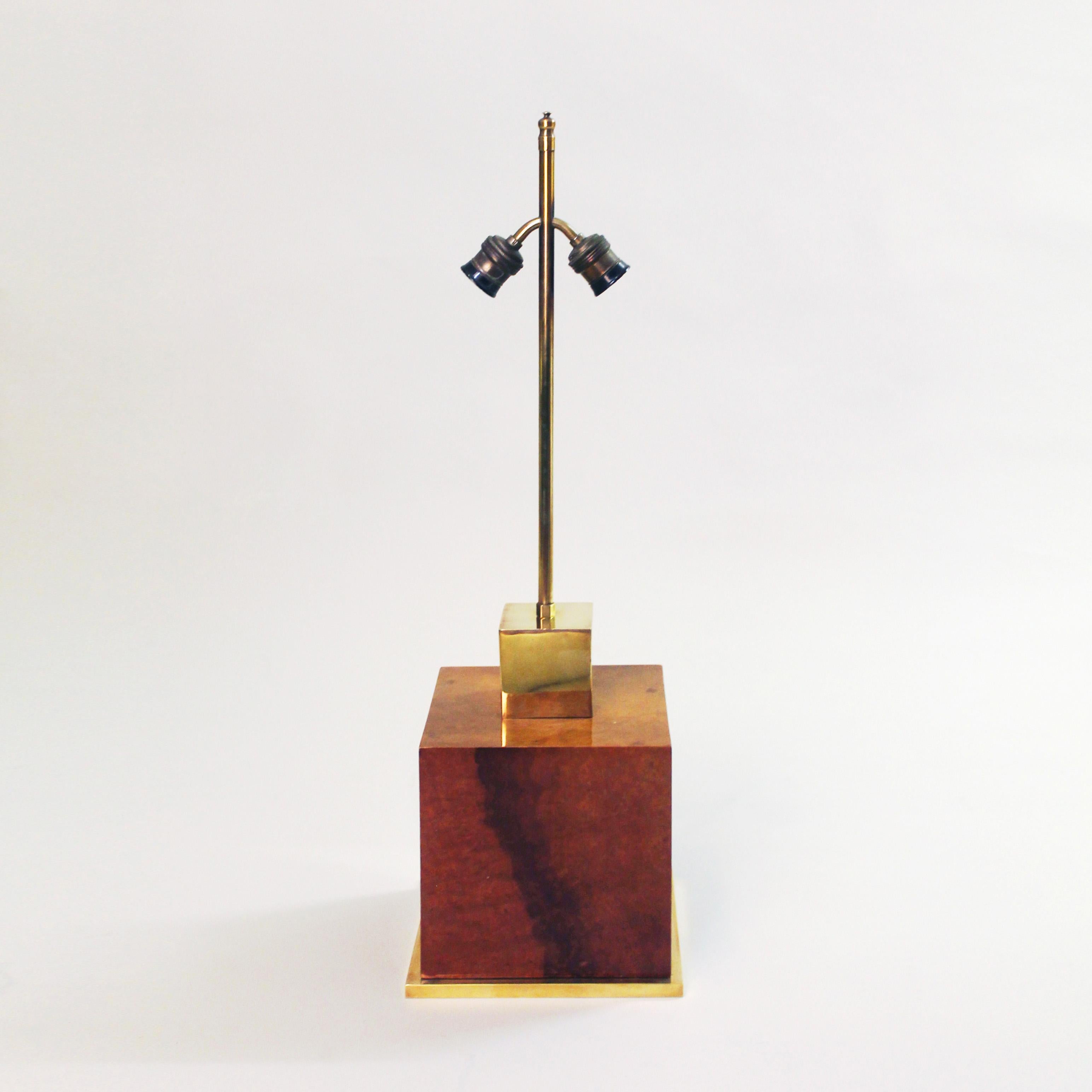 Unique table lamp by Aldo Tura with burl walnut lacquered square body, standing on a brass base and brass finishings with two bulb fittings. Rewired.

CREATOR: Aldo Tura

PLACE OF ORIGIN: Italy

DATE OF MANUFACTURE: c. 1970's

PERIOD: