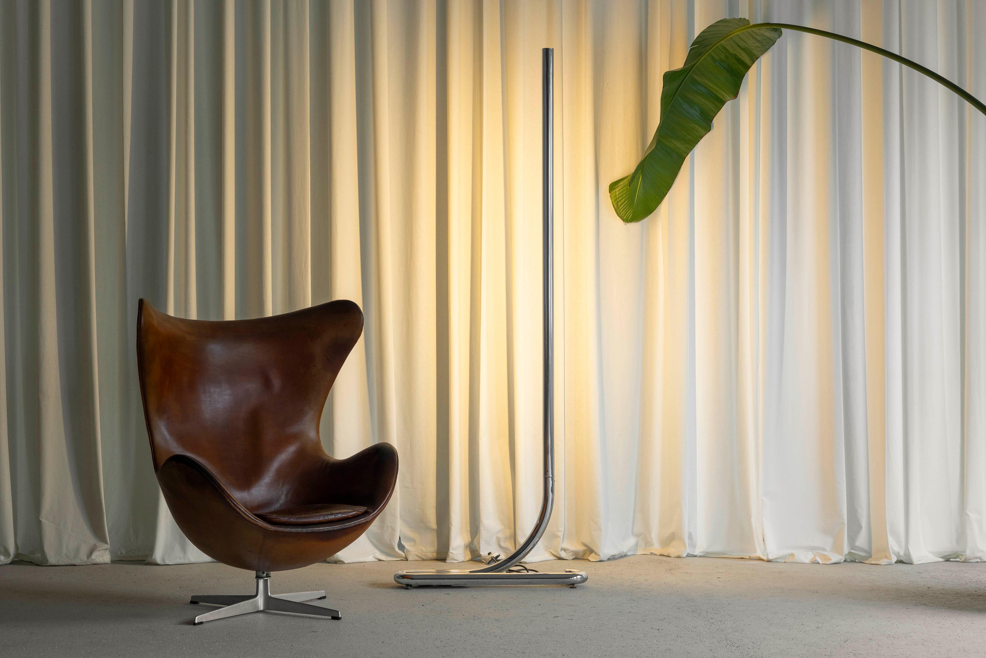 The TC2 floor lamp, designed by Aldo van den Nieuwelaar and manufactured by Artimeta in the Netherlands in 1972, is a striking example of minimalist design. Known for its clean lines and elegant simplicity, this floor lamp embodies van den