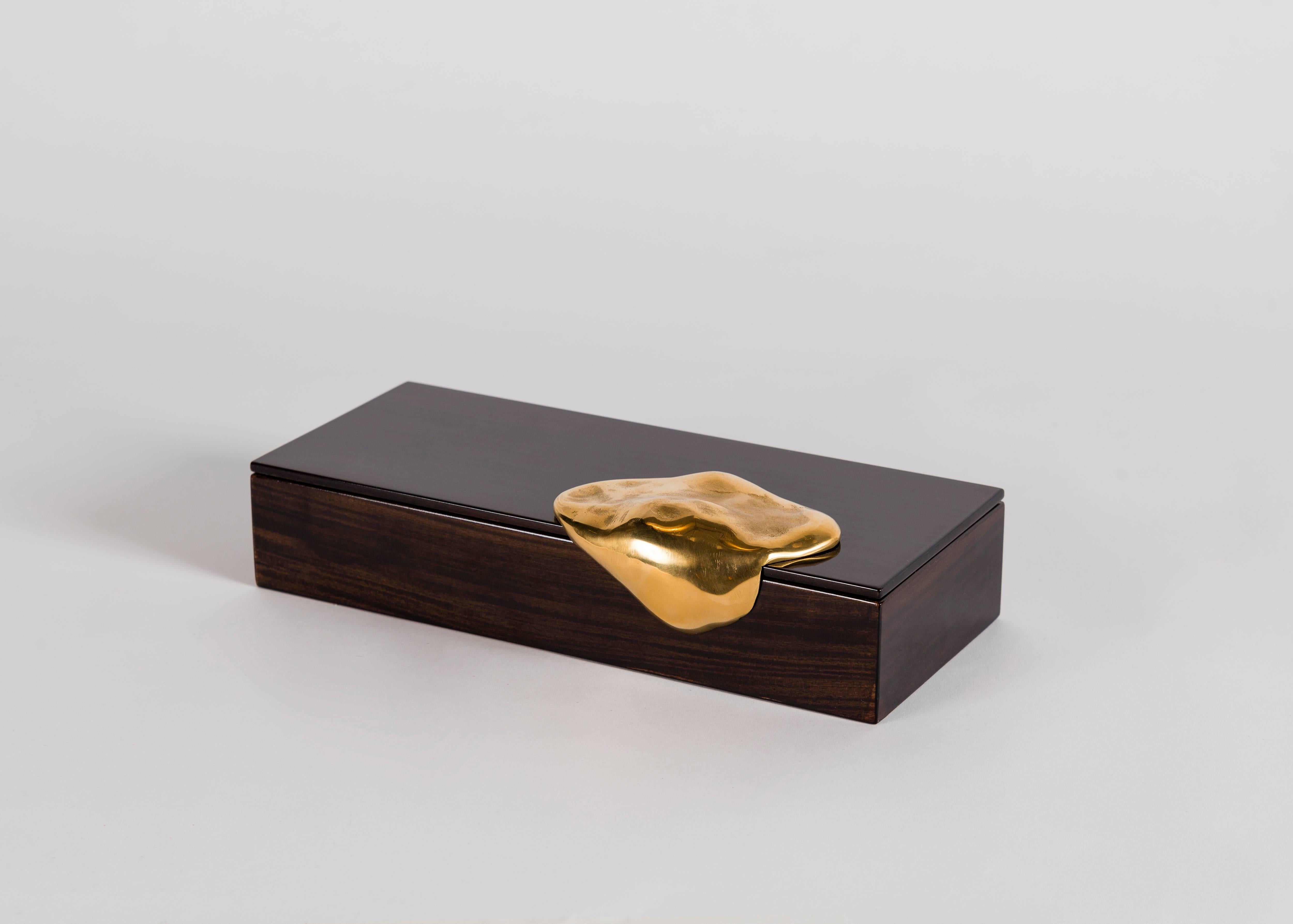 Hand polished royal oak box with gilt bronze handle. The interior base of the box is lined with hand woven silk. Edition of 100.

A collaboration between Achille Salvagni and Fabio Gnessi, Aldus aims to revive the aesthetic ideals of Greek and Latin