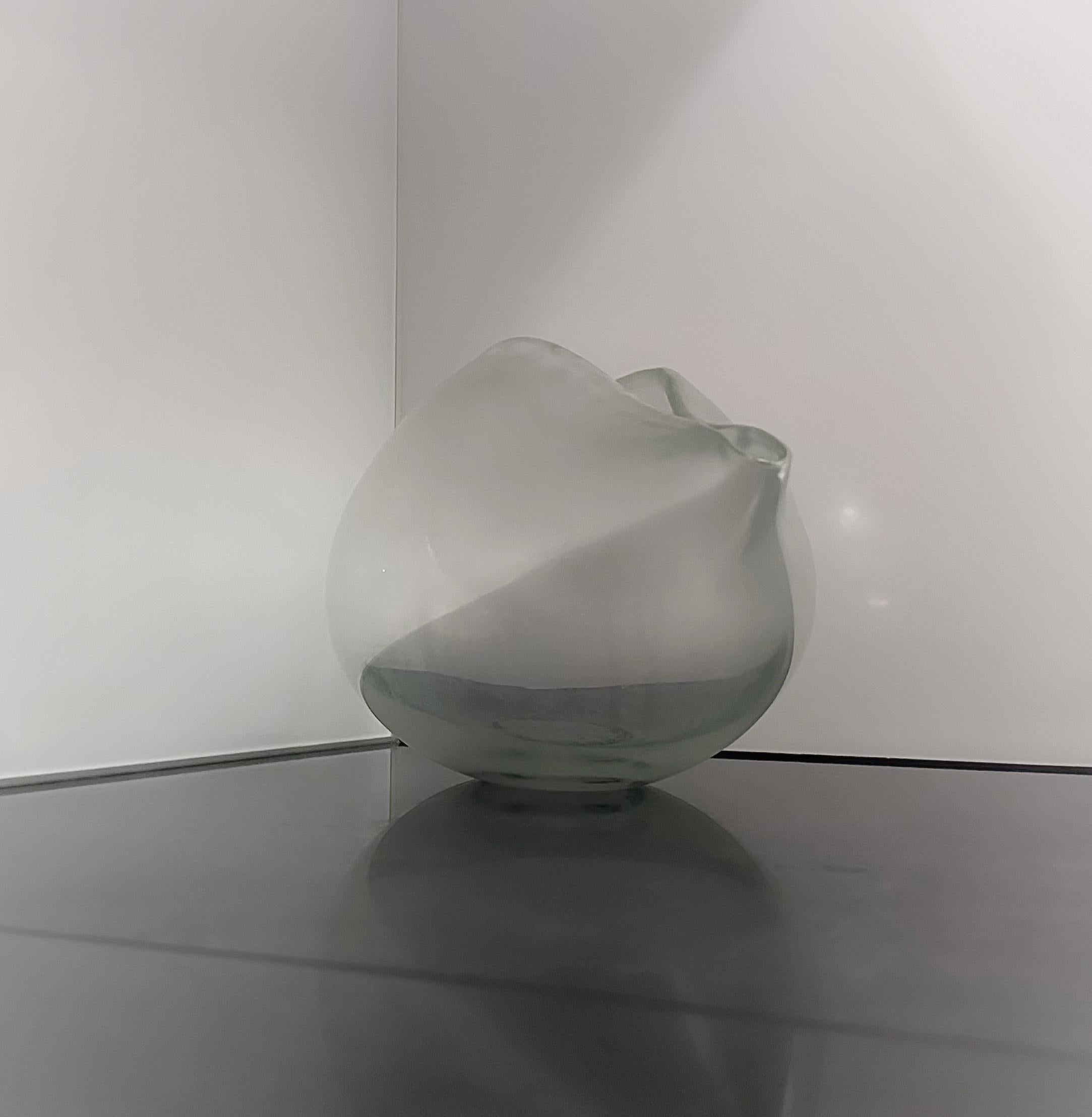 Colourless crystal glass, appealingly iridescent. The vase is in perfect condition.