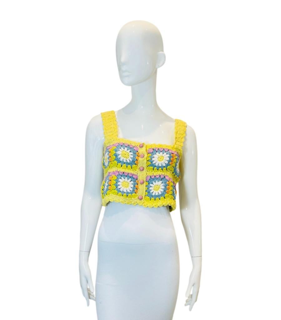Alemais Crochet Cotton Crop Top
Yellow crop top designed with floral pattern to the front and rear.
Detailed with lilac button closure along the centre, wide shoulder straps and square neck. Rrp £210
Size – 8UK
Condition – Very Good
Composition –
