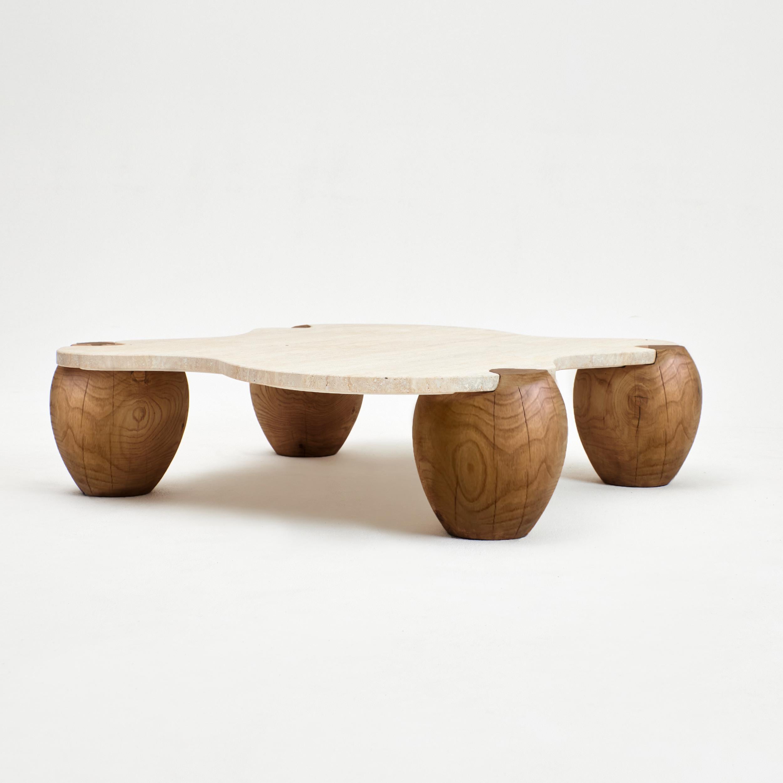 Alentejo coffee table.
Designed by Project 213A in 2022.
Made to order.
This organic-shaped coffee table stands is made from Travertine and assembles like a puzzle onto the four wooden legs. Each legs is made from solid chestnut wood and is