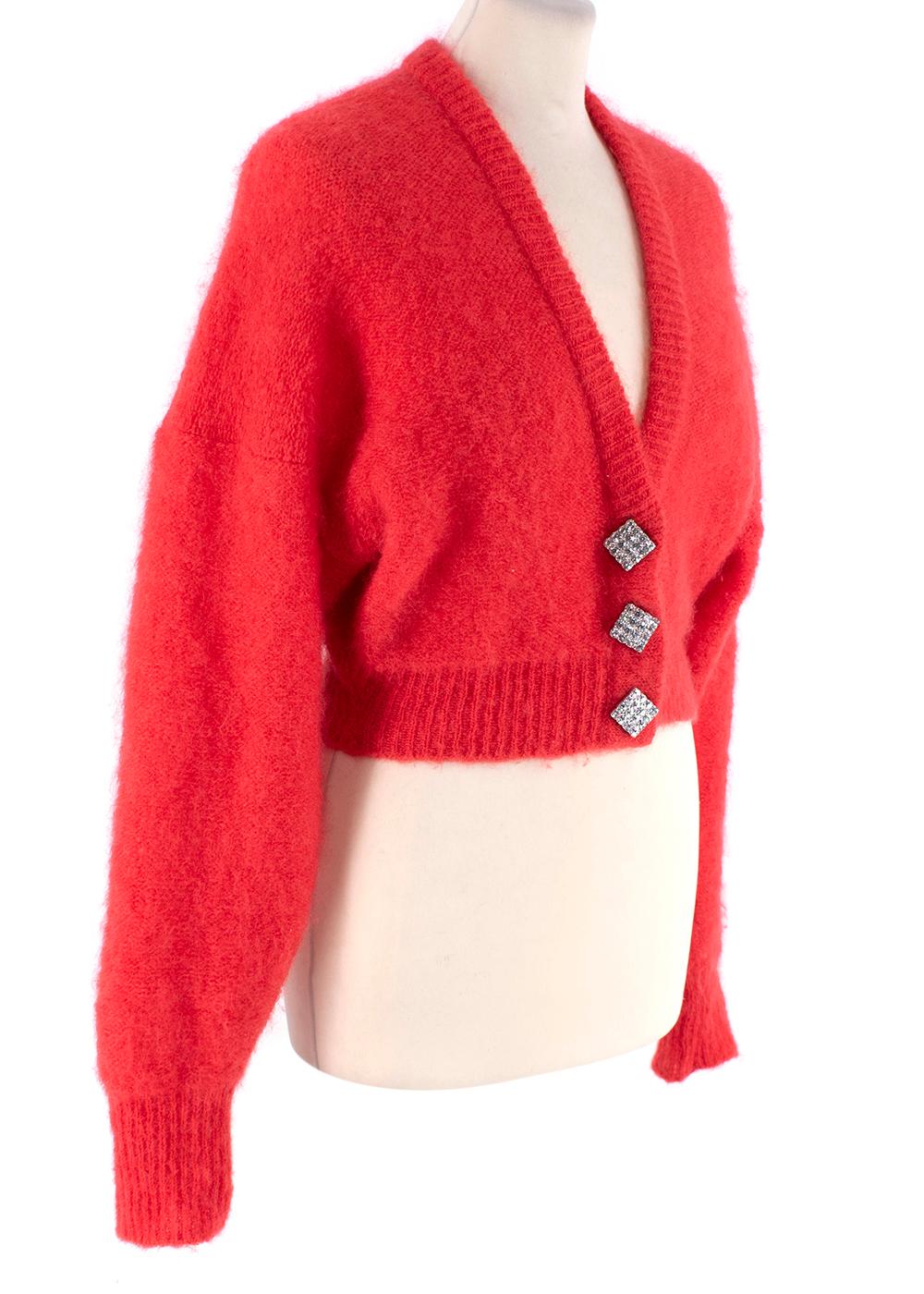 Alessandra Rich Crystal Embellished Mohair Blend Cardigan

- Square shaped crystal embellished button fastening at the front
- Ribbed cuffs and hem
- Deep V-neck
- Cropped fit

Materials:
82% Mohair
8% Elastane

Made in Italy
Dry clean only

PLEASE