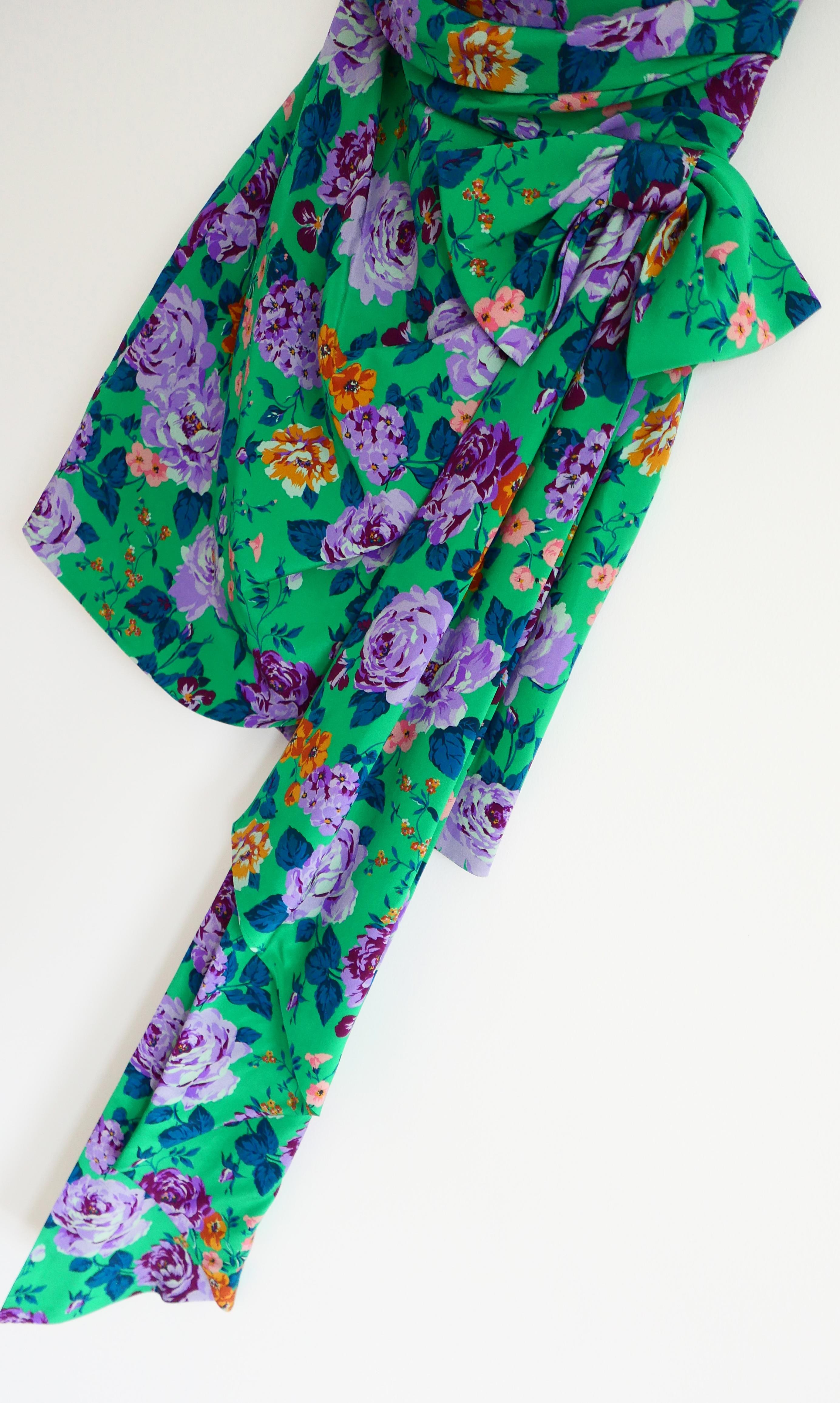 Stunning Alessandra Rich floral print silk mini dress. Bought for £1395 and new with tag. Made from emerald green silk crepe with a richly printed lilac and tangerine floral print. It has a super sext 1980s inspired cut with ruched, sweetheart