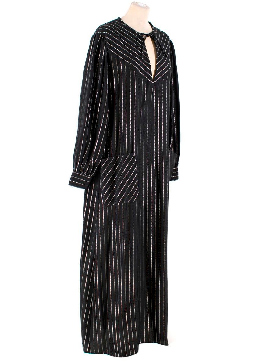 Alessandra Rich Silk Metallic Striped Maxi Dress

- Black silk with silver metallic polyester striping
- Maxi length
- Long sleeved with button cuffs
- Keyhole detail at neckline with self tie fastening
- Front patch pockets
- Loose, relaxed