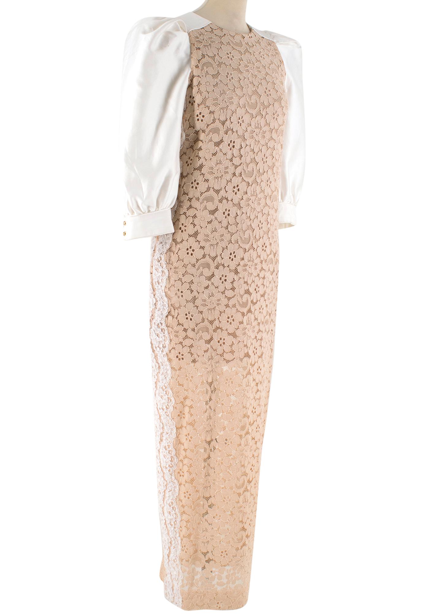 Alessandra Rich elegant long dress made of rose-pink floral lace with white puffed sleeves.

- Three-quarter sleeves
- Gold-tone cuff buttons
- Round collar
- Concealed zip fastening at back
- Back open-split 

Composition FAB218:
(A)
- 70% cotton
-