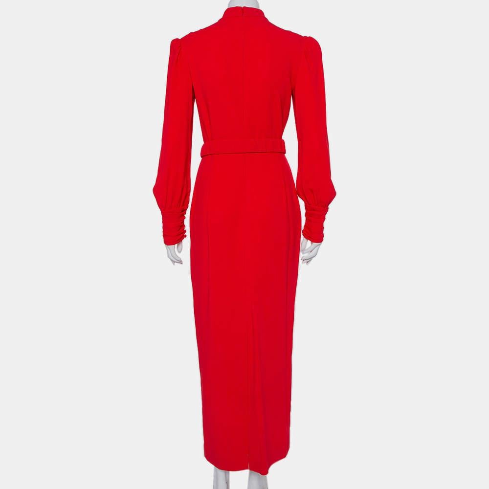 You'll find occasions to wear this beautiful gown from Alessandra Rich! The red crepe creation features a flattering silhouette that is enhanced with an embellished heart belt on the waist, button detailing on the left shoulder, and long sleeves