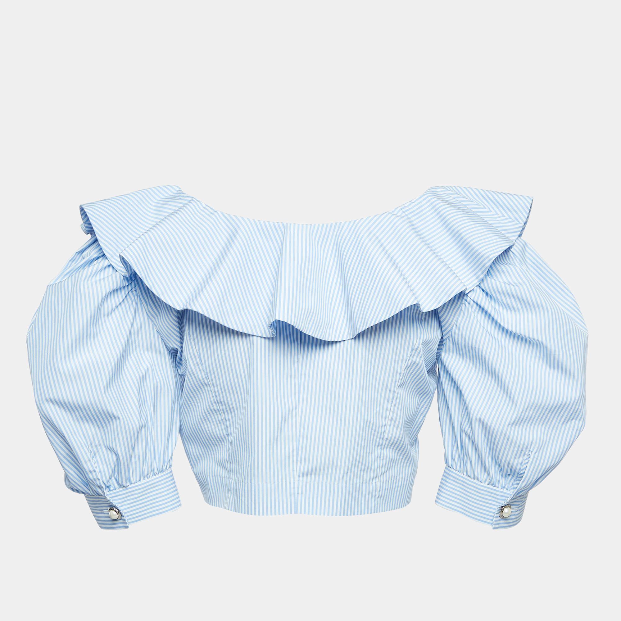 Discover effortless chic with this designer crop top. Combining comfort and style in one sleek piece the top is perfect with skirts and pants. Whether dressed up or down this crop top adds a touch of sophistication to any outfit.