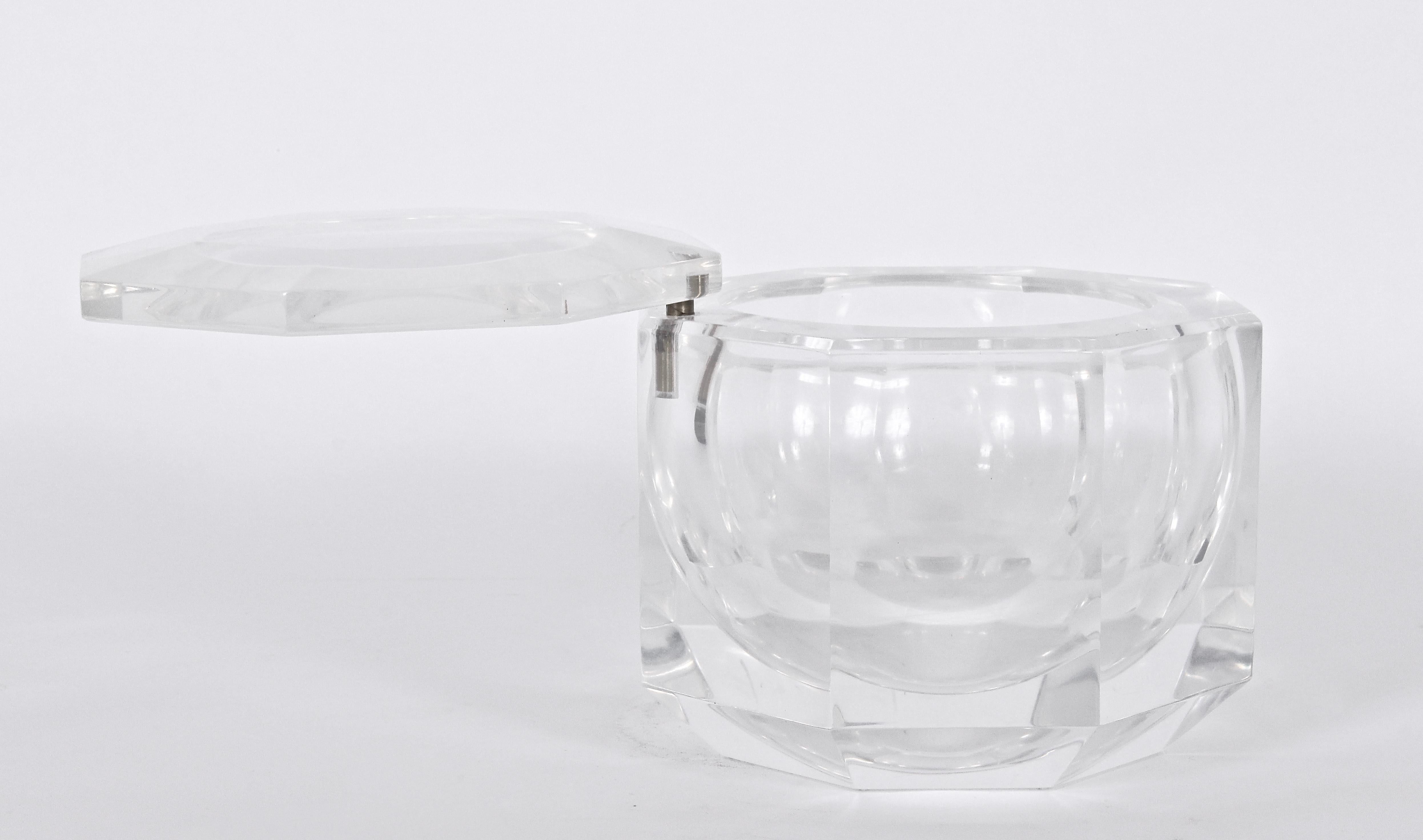 Italian Modern Alessandro Albrizzi Faceted Clear Lucite Ice Bucket with pivoting Lucite Cap. Featuring a luminescent and heavy, rounded Lucite form with circular Swing top. Refracting. Reflective. Hollywood Regency. Fine design. 
  