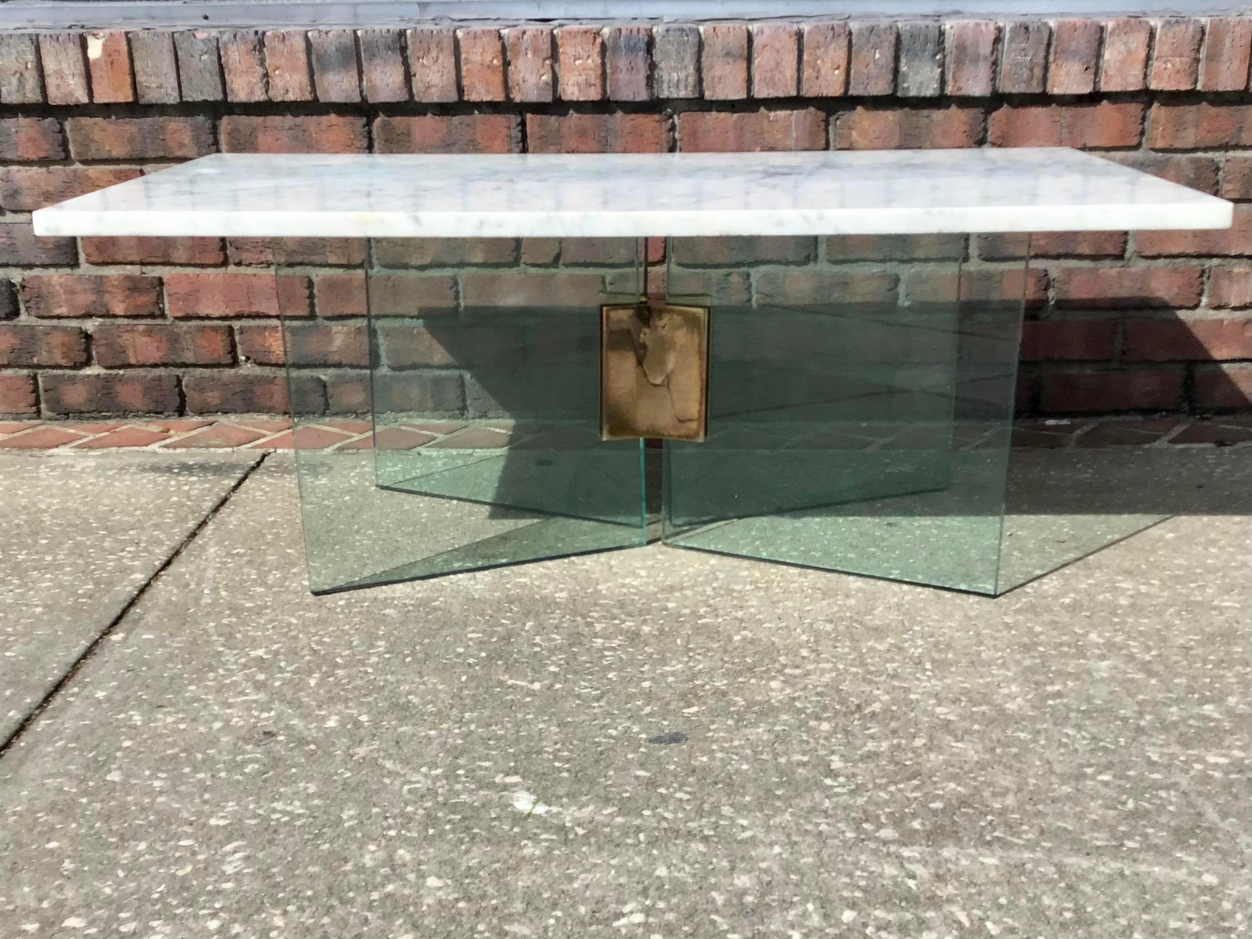 Amazing Alessandro Albrizzi coffee table with glass and brass base with white marble top. Very nice and elegant coffee table with sturdy glass base and a marble top. A few minor stains on marble but consistent with its age.