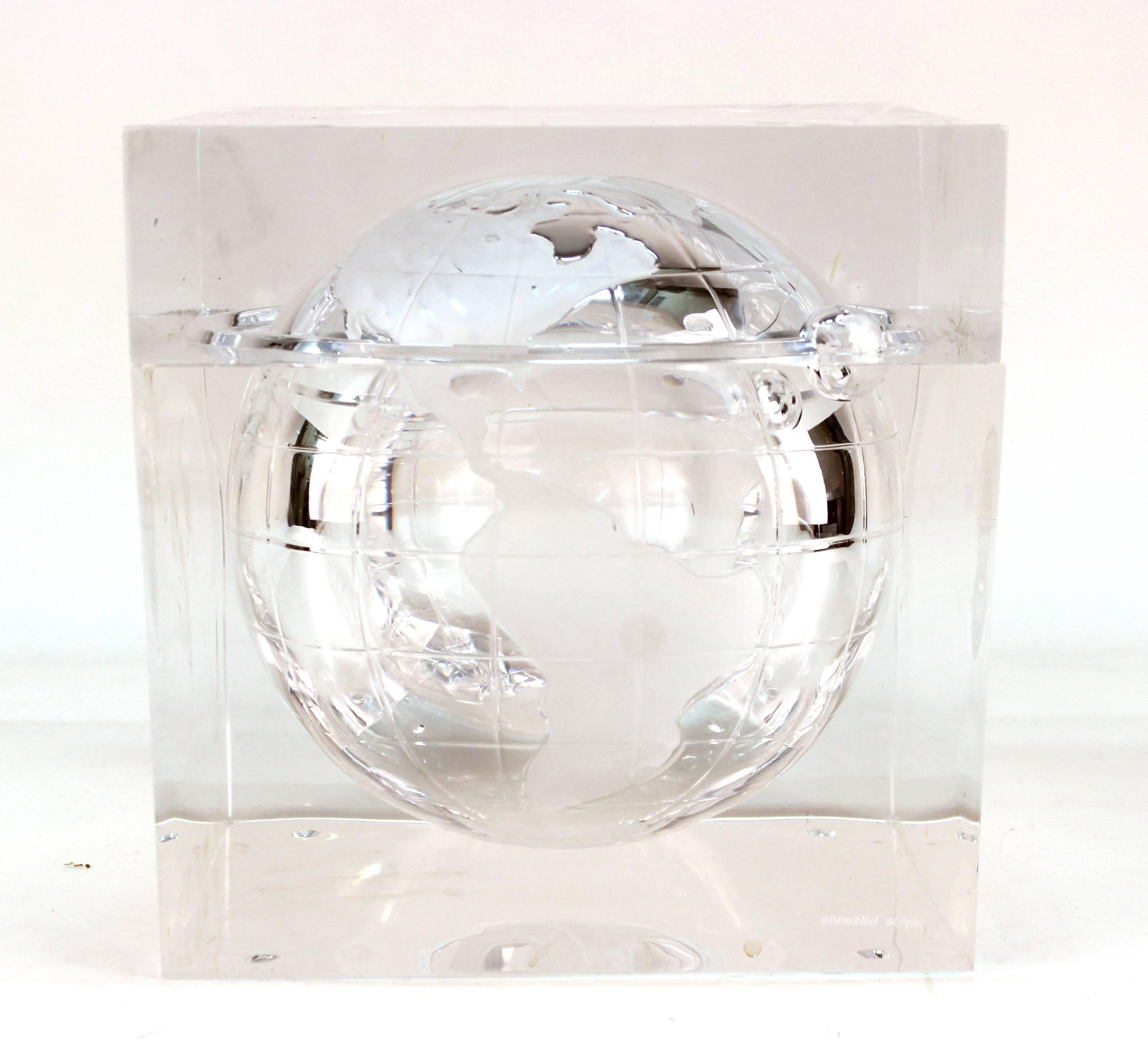 Alessandro Albrizzi ice bucket with globe. Designed as a clear acrylic or Lucite cube with incised globe. Features also include a removable top. Marked [annealed acrylic] on one corner. Scrapes and nicks throughout with wear appropriate to use. The