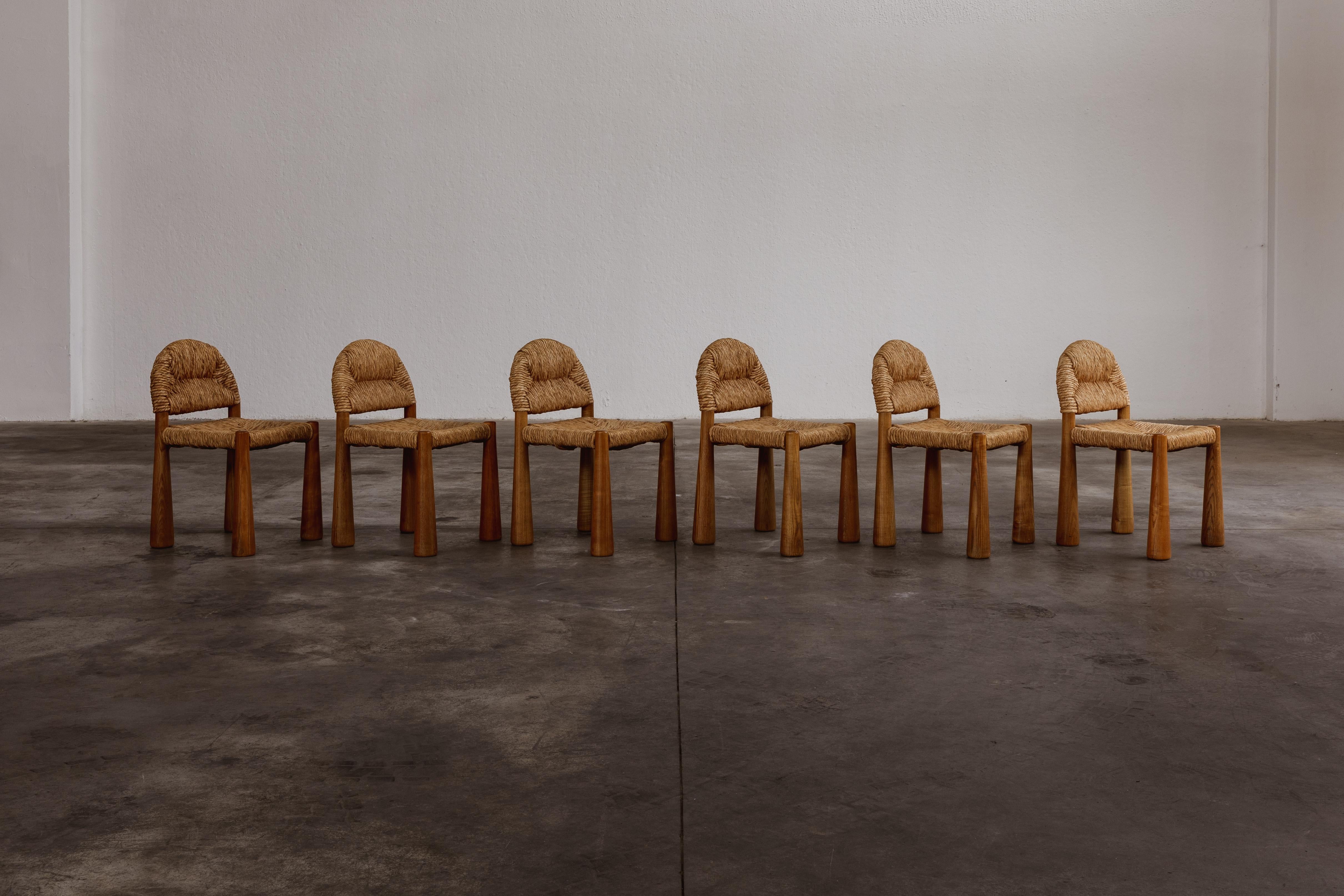 Alessandro Becchi “Toscanolla” dining chairs for Giovannetti, ash and straw, Italy, 1970, set of six.

This rare 
