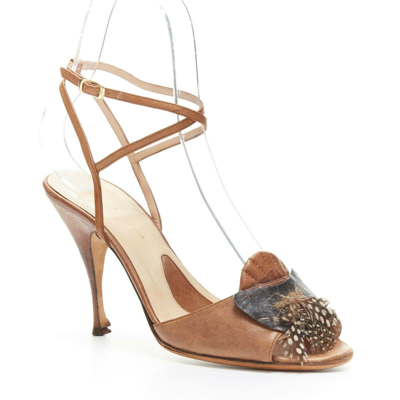 ALESSANDRO DELL ACQUA leather open-toe high heel sandal exotic bird feather EU37 
Reference: EACN/A00087 
Brand: Alessandro Dell'Acqua 
Material: Leather 
Color: Brown 
Extra Detail: Brown calfskin leather. Open toe strappy sandals. Exotic bird