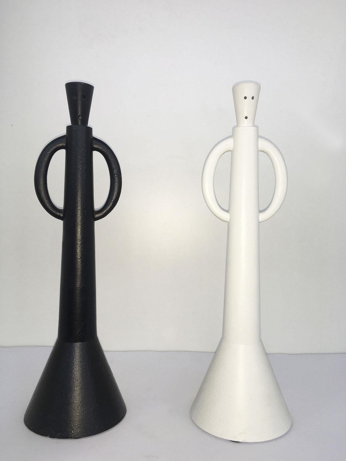 This artwork was  create by the Italian artist Alessandro Guierriero, and it is a multiple of a serie of specimens made in limited edition not numbered.
The set is forged in aluminum and painted in black and white. Their arms are handles to manage