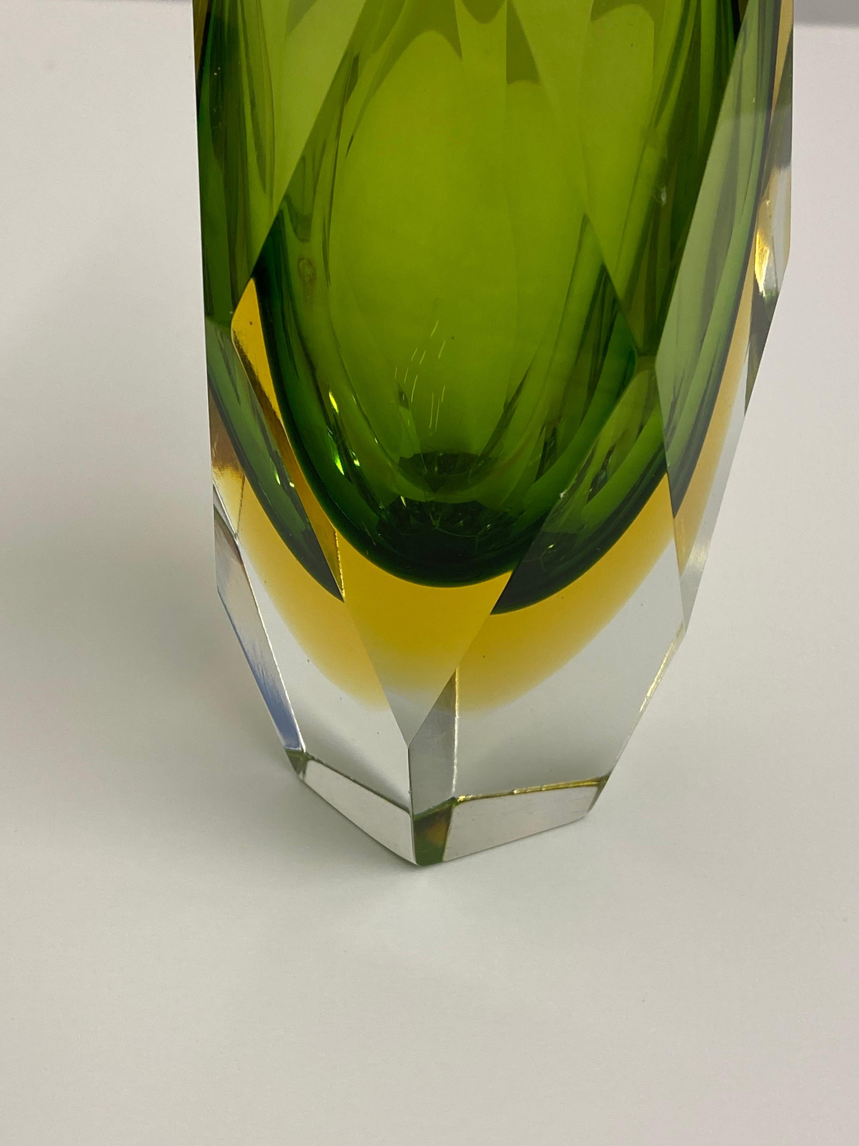 Alessandro Mandruzzato faceted vase in clear yellow and green. Beautifully layered and ground down to perfection! The yellow compliments the green perfectly! Nice size measuring: 7.5 tall and 3.25 across!