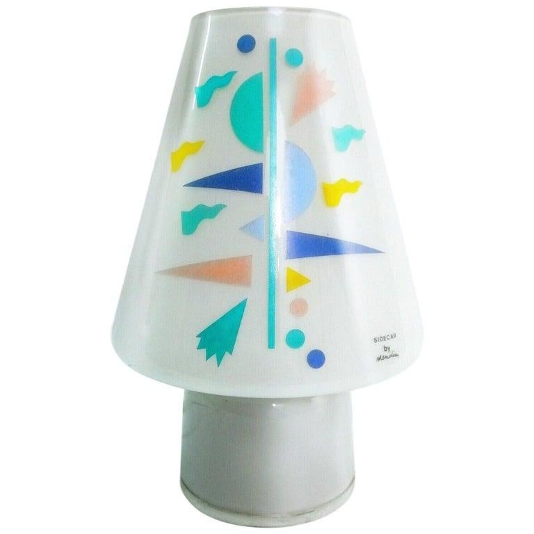 Alessandro Mendini for Artemide Sidecar table lamp Postmodern Murano glass, 1980s. Exceedingly rare Memphis era design, signed. Gorgeous blush pink, teal, sky and delft blue, as well as canary yellow geometric design on the traditional lingham form