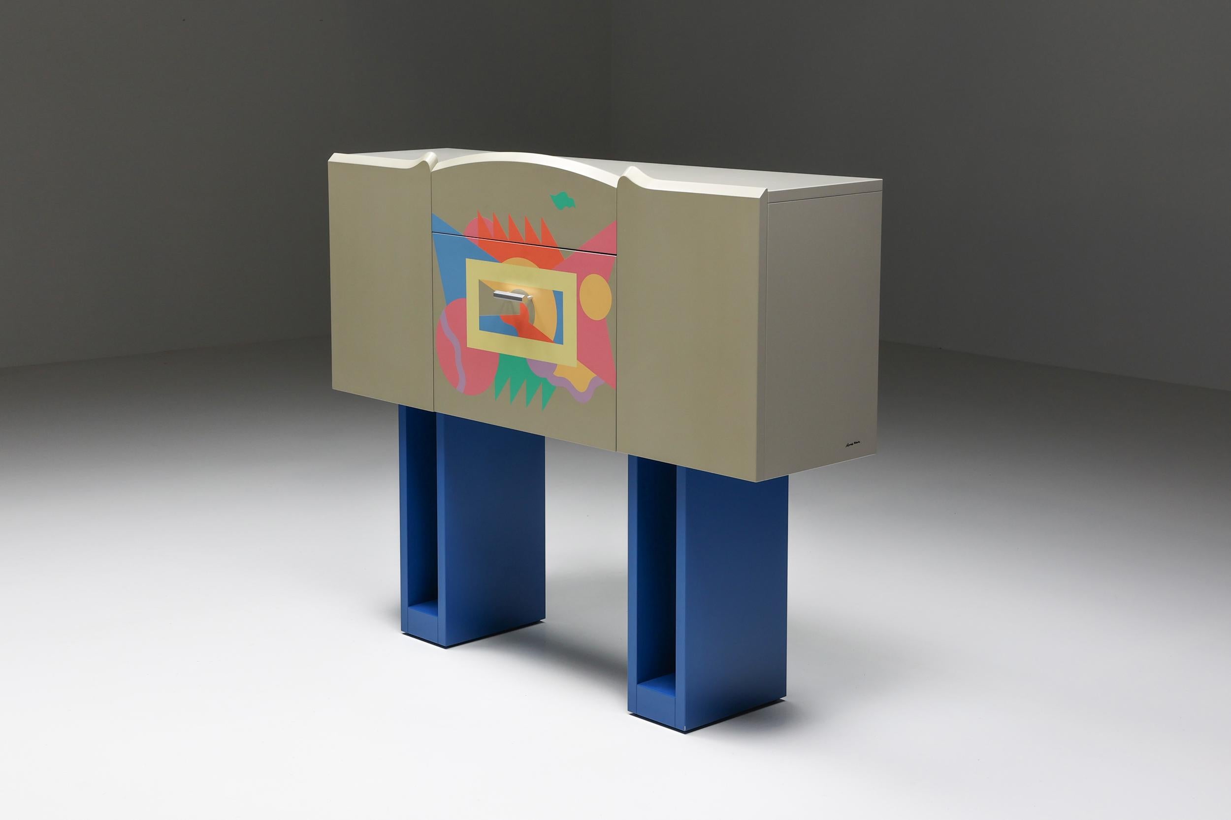 Mendini; Italian Design; Italy; 1984; Zanotta; cabinet; Dry Bars; Signed; Alessandro Mendini; 

Italian design bar cabinet cantaride by Alessandro Mendini for Zanotta, designed in 1984. Frame in grey lacquered wood with hand-painted polychrome