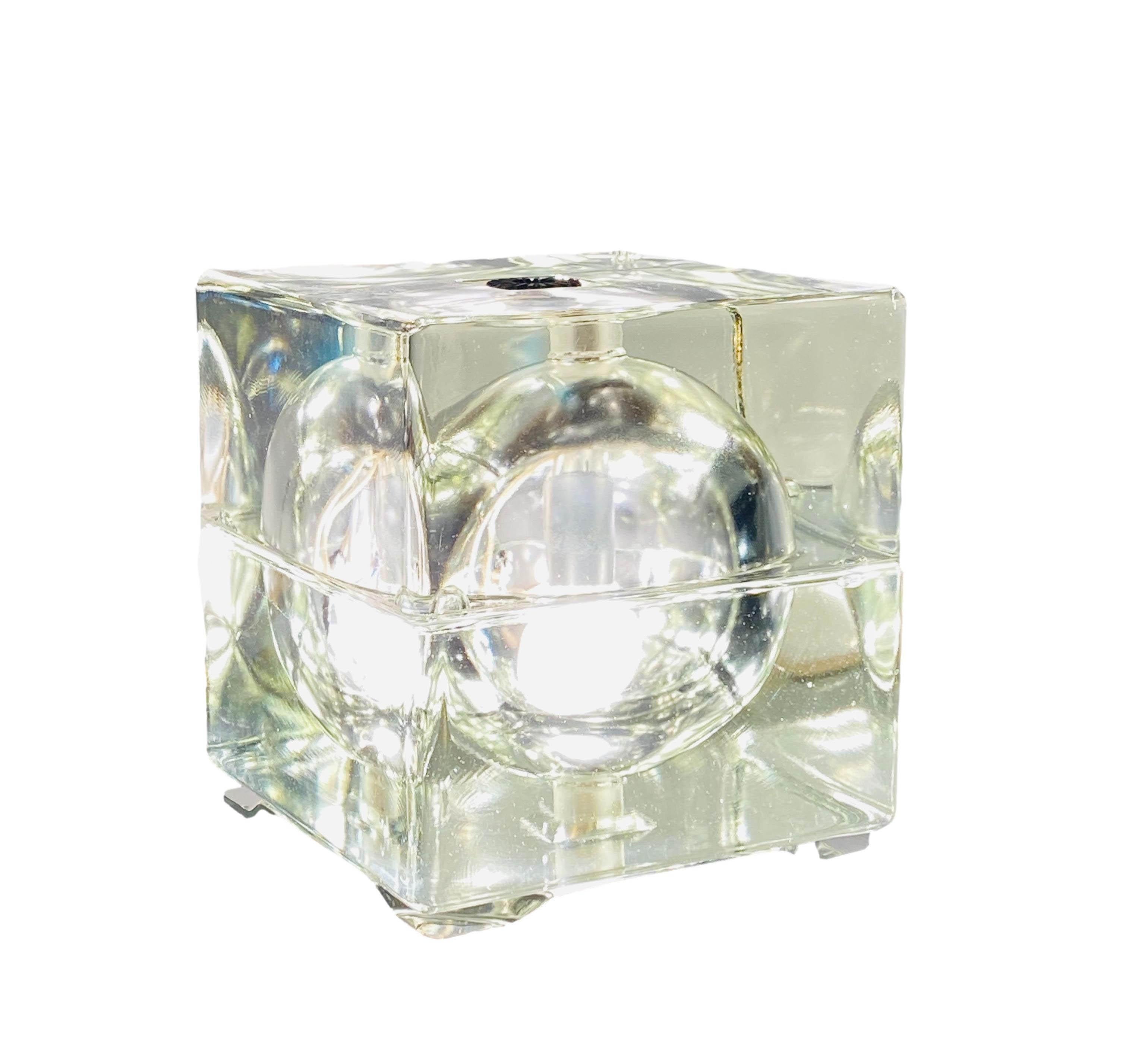 Cubosfera table lamp by Alessandro Mendini for Fidenza Vetraria, Italy 1968. Made of solid transparent glass with metal details. The upper and lower parts together form a cube with a sculpted globe. The lamp is equipped with two illuminating bodies