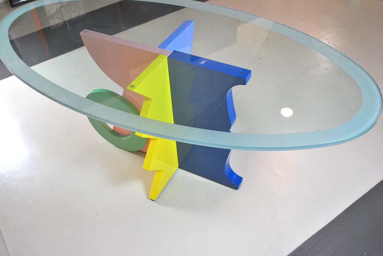 Table in multi-color lacquered wood with a smoked glass on top by Alessandro Mendini one of the most important designer of Memphis Milano Studio

Biography

Alessandro Mendini was born in Milan in 1931. After a long experience with Nizzoli