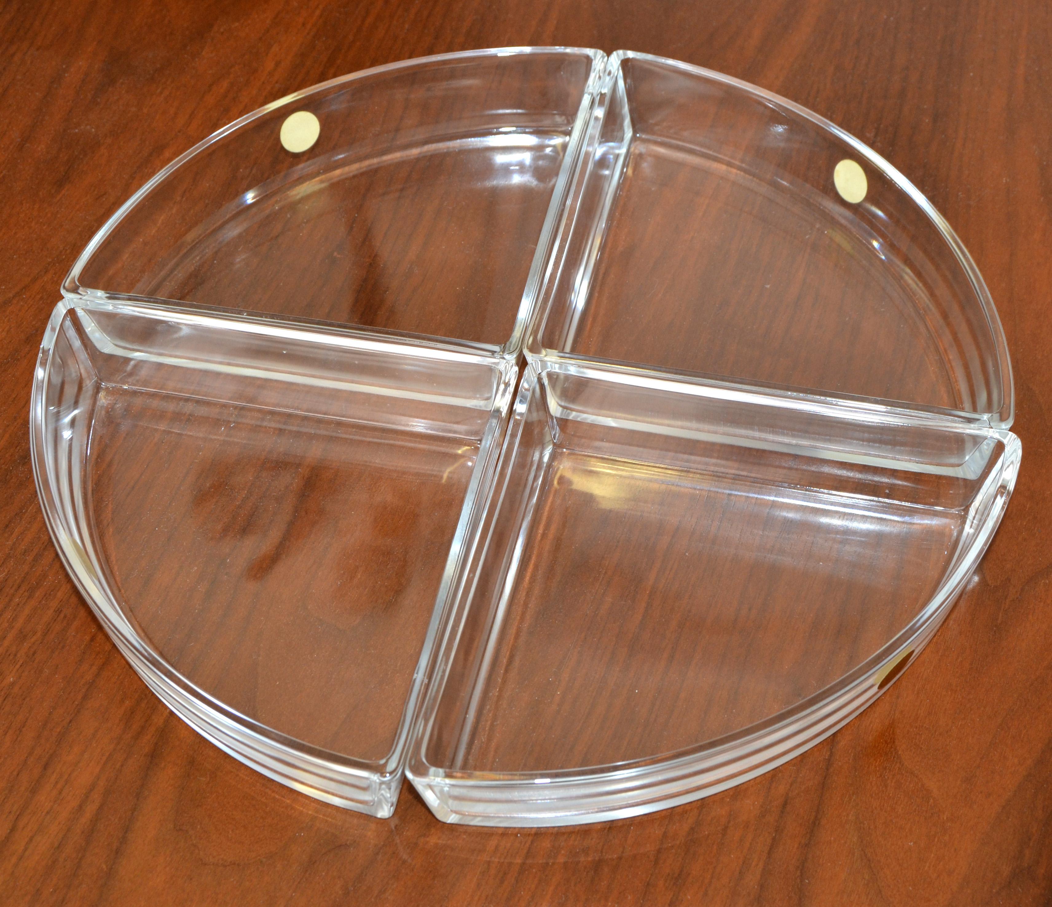 This Listing offers the Alessi 4 compartments Hors d'oeuvres service in crystal glass designed by Ettore Sottsass, made in Italy, circa 1970s. 
Mid-Century Modern Serveware, Barware in minimalism design and heavy lead crystal. 
All 4 Triangle