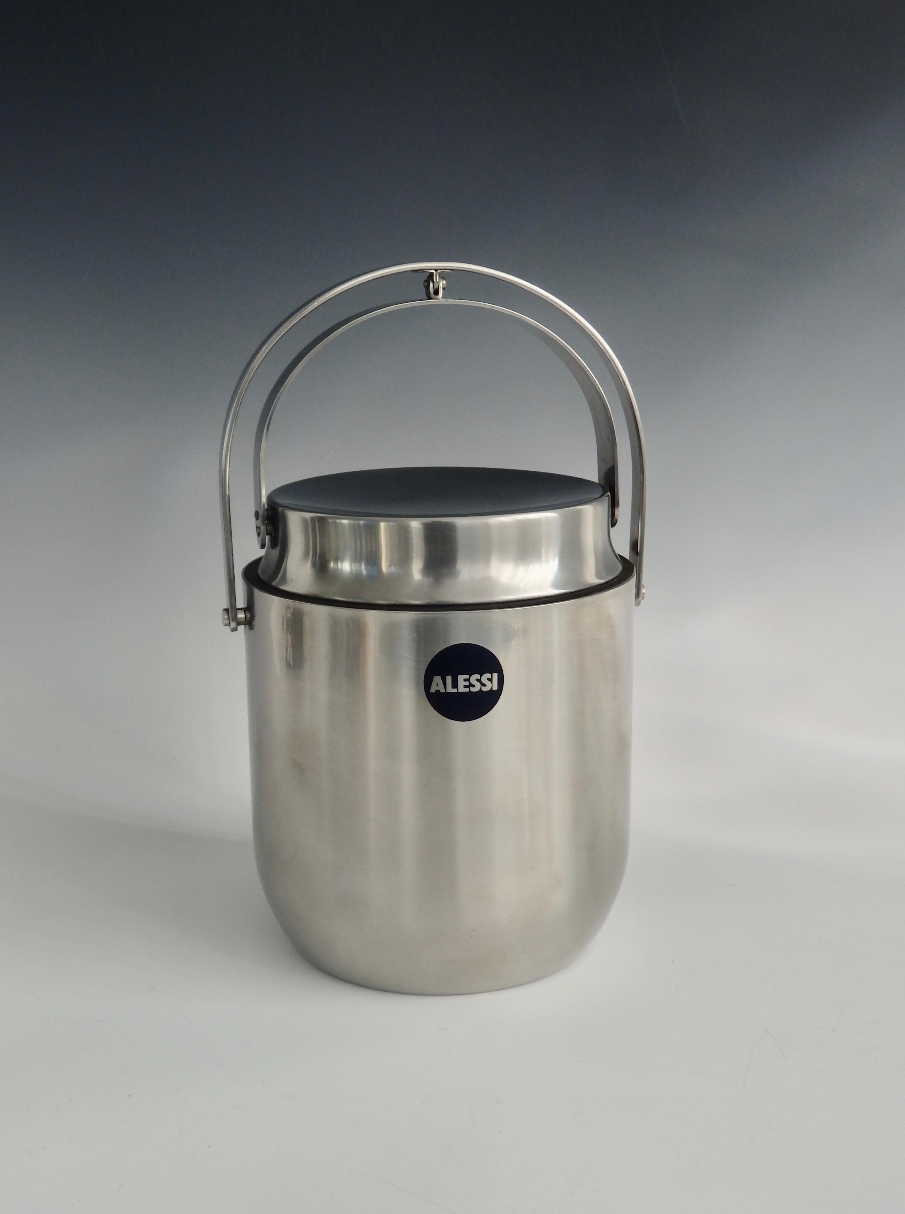 Alessi stainless steel with lid that retracts with the handle. Does have an interior lining. Add 3.75 for handle mechanism for a total of 11 tall.