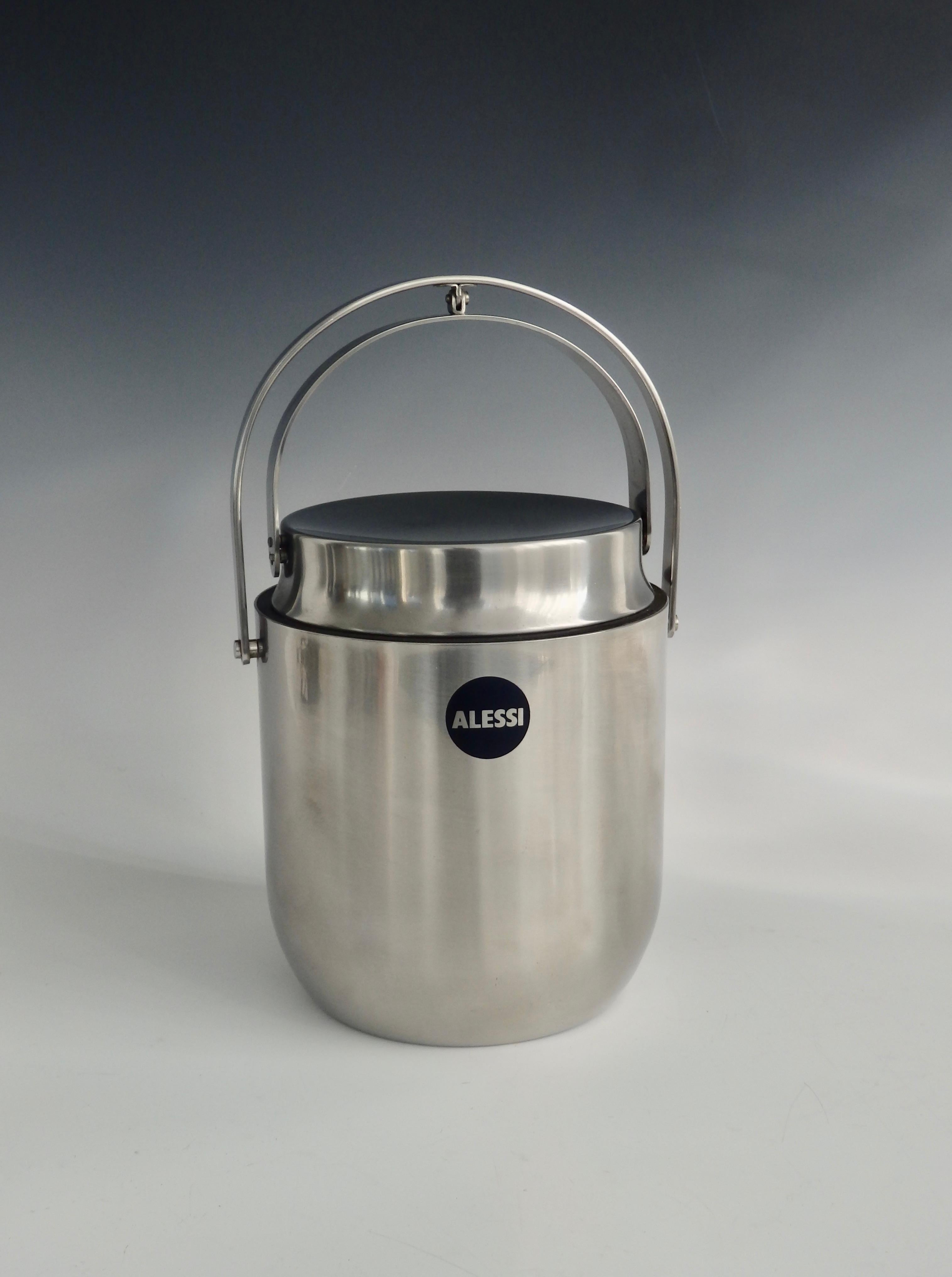 Alessi stainless steel with lid that retracts with the handle. Does have an interior lining. Add 3.75 for handle mechanism for a total of 11 tall.