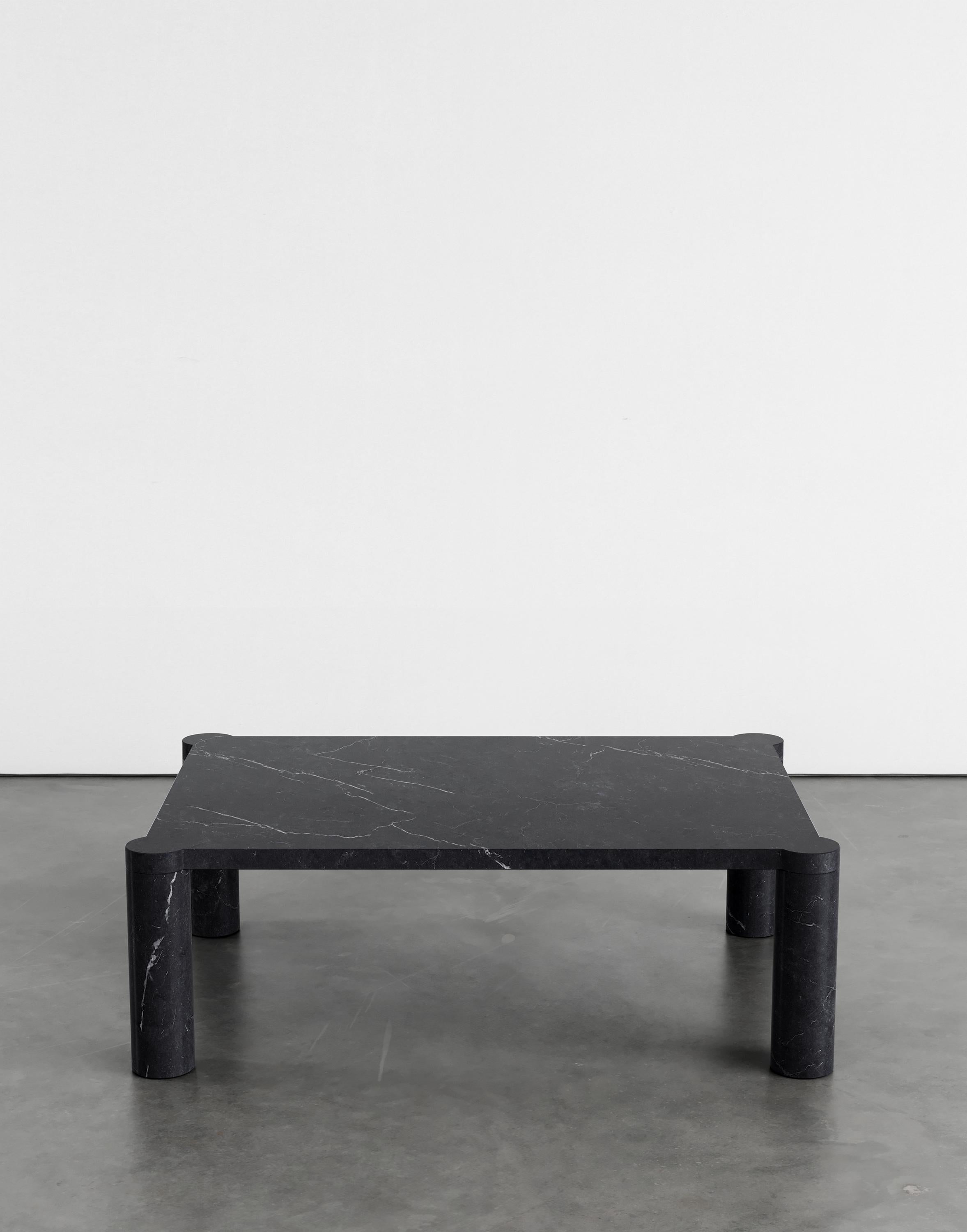 Alessio 107 coffee table by Agglomerati.
Dimensions: D 100 x W 70 x H 33 cm.
Materials: Nero Marquina marble.
Available in other stones. 

Alessio is a coffee table enclosed by four cylindrical legs which sit seamlessly flush under the