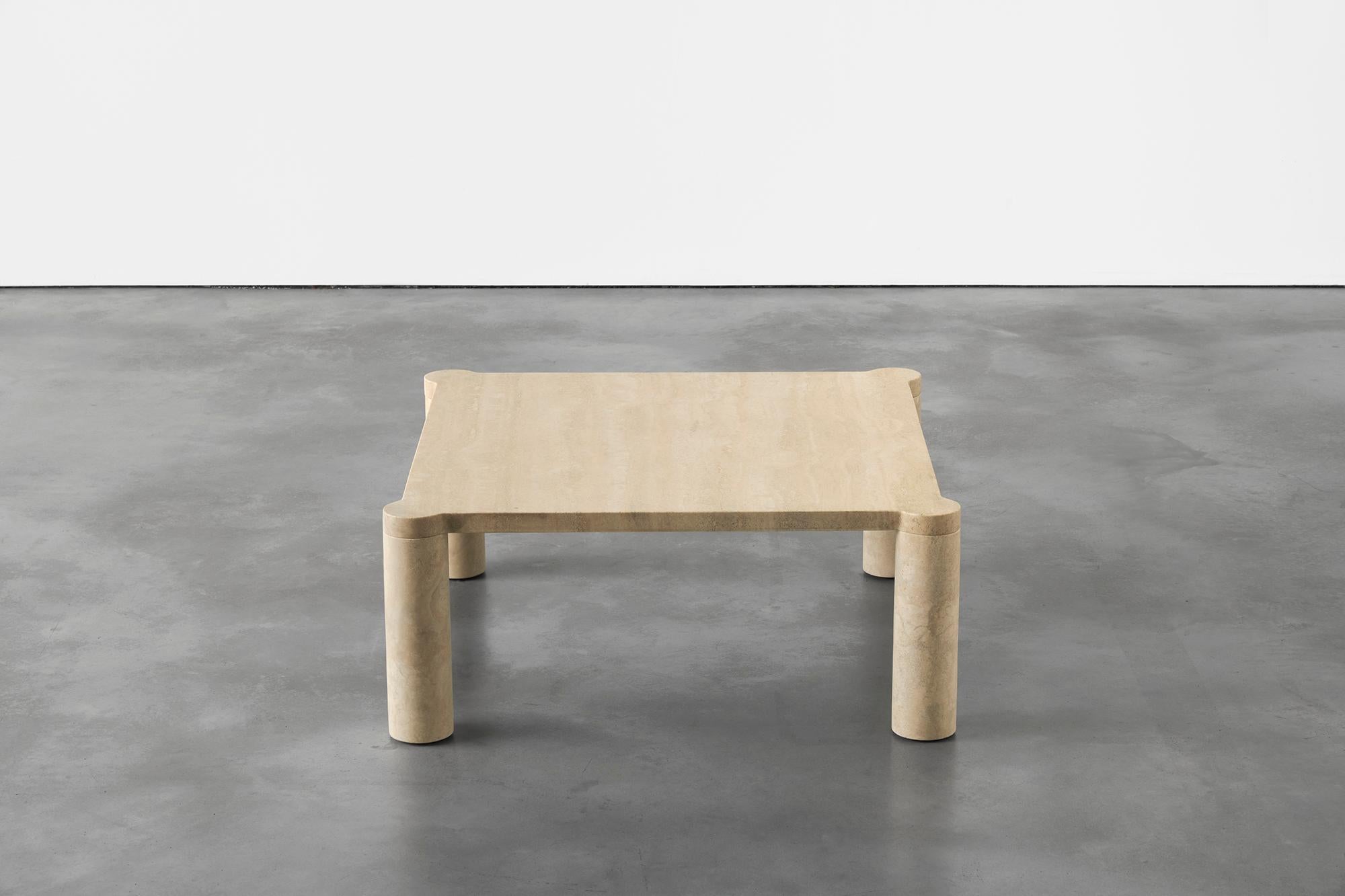 Alessio travertine coffee table by Agglomerati
Dimensions: D 80 x W 80 x H 33 cm
Materials: classic traverine
Available in other stones.

Alessio is a square coffee table enclosed by four cylindrical legs which sit seamlessly flush under the