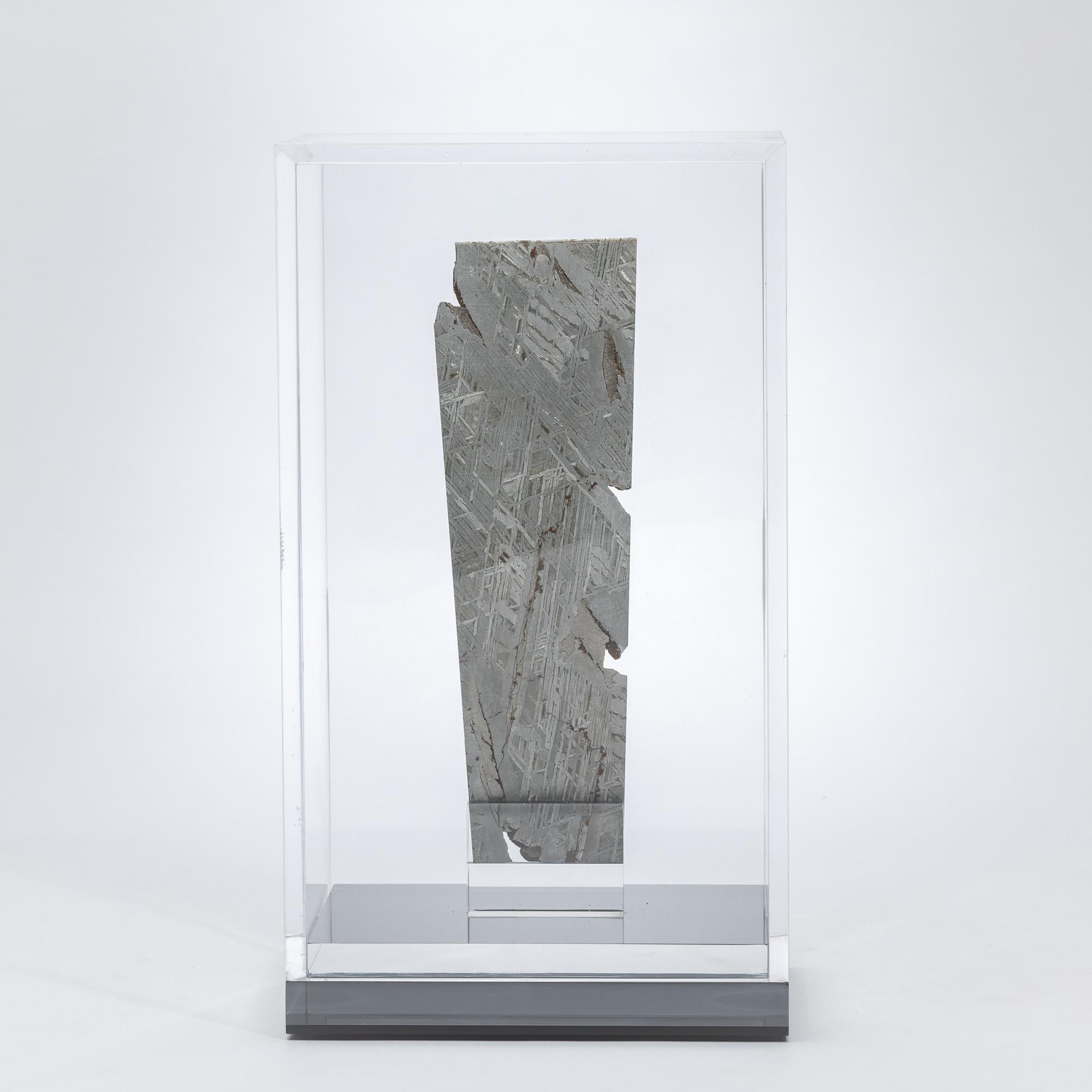 Aletai Meteorite Fragment
Mounted in a Custom Acrylic Display Box
Xinjiang Uygur Autonomous Region, China

This specimen is a fragment of the Aletai meteorite, one of the largest known iron meteorites ever recorded on Earth. Originally discovered in