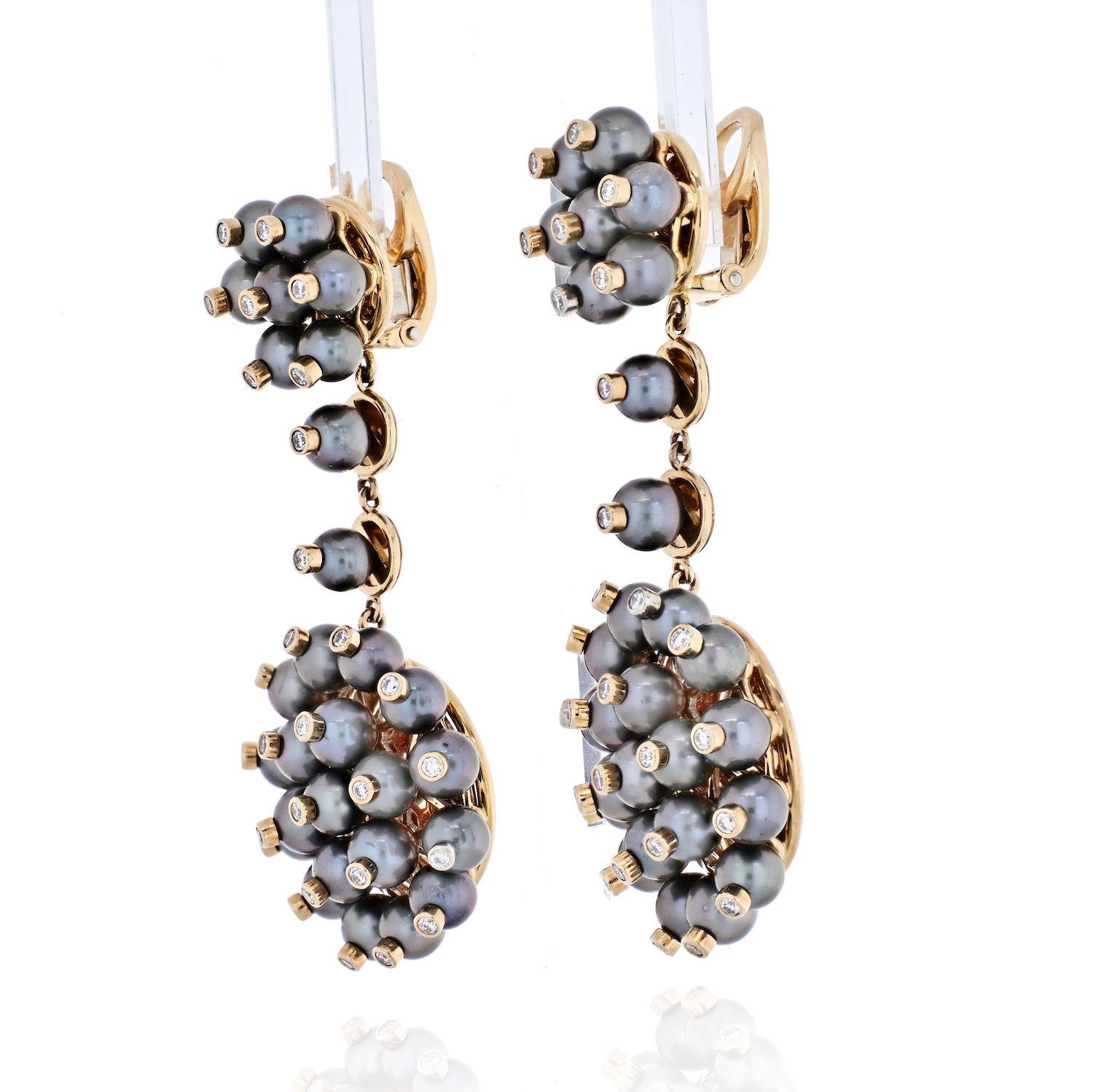The earrings feature full-cut diamonds weighing a total of 1.12 carats, enhanced by grey cultured pearls measuring 5.00 mm, set in 18k gold, marked Aletto Bros.
Dimensions: 2-1/4 inches x 1 inch
*Note: earrings are designed for non-pierced ears
