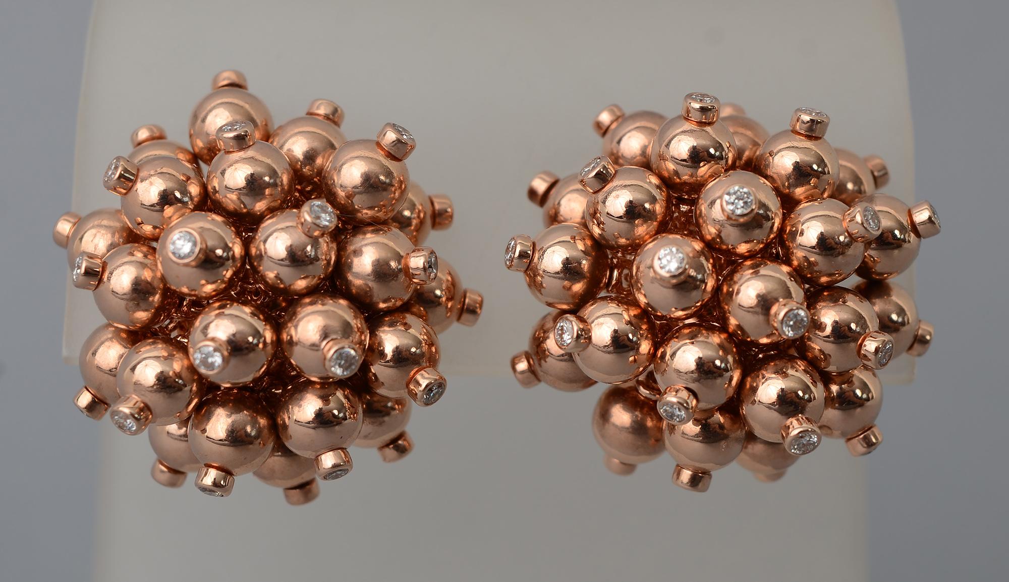 Chic and playful gold ball cluster earrings in 18 karat rose gold. Each ball is tipped with a diamond for a hint of bling.
The earrings have clip backs that can be converted to posts. They are one inch in diameter.