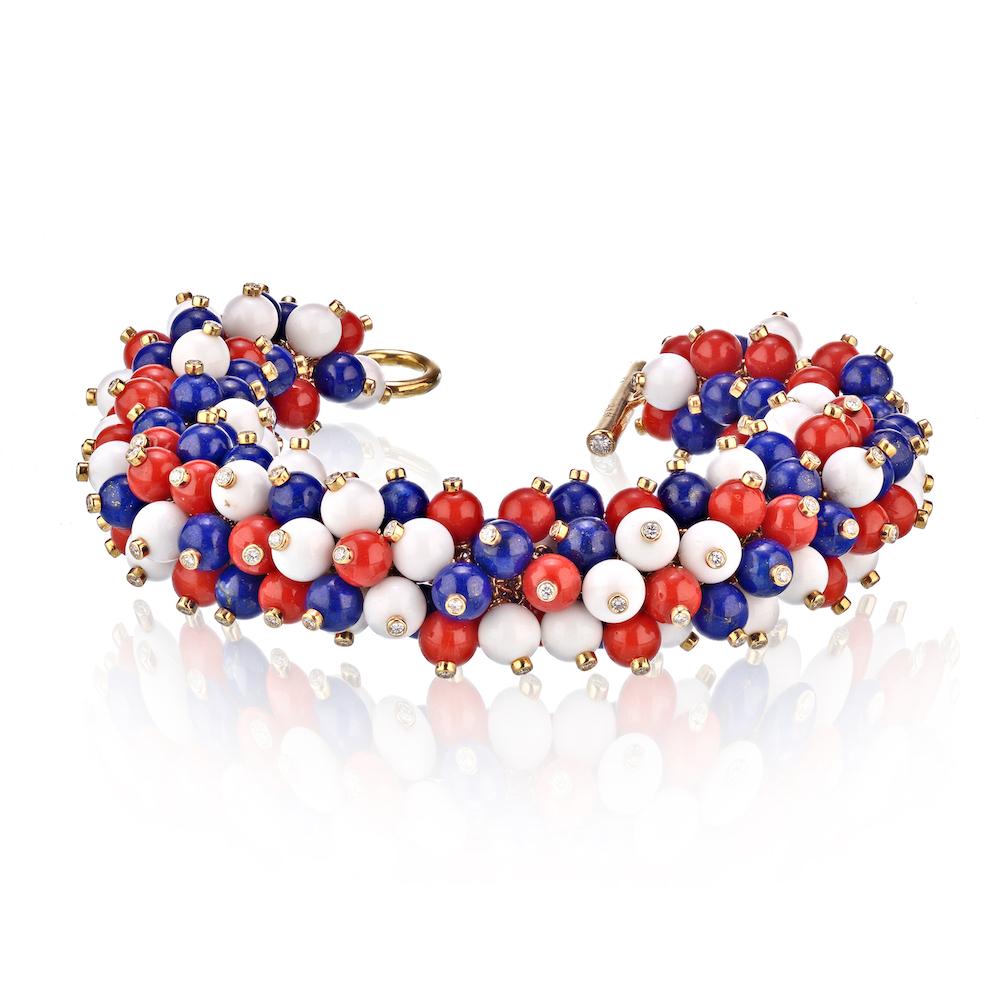 This whimsical Pom Pom jewelry set by Aletto Brothers features one ring, a pair of ear-clips and a bracelet. Each items consists of vibrant lapis lazuli, as well as red and white agate beads with a bezel set diamond on each bead, set in 18kt yellow