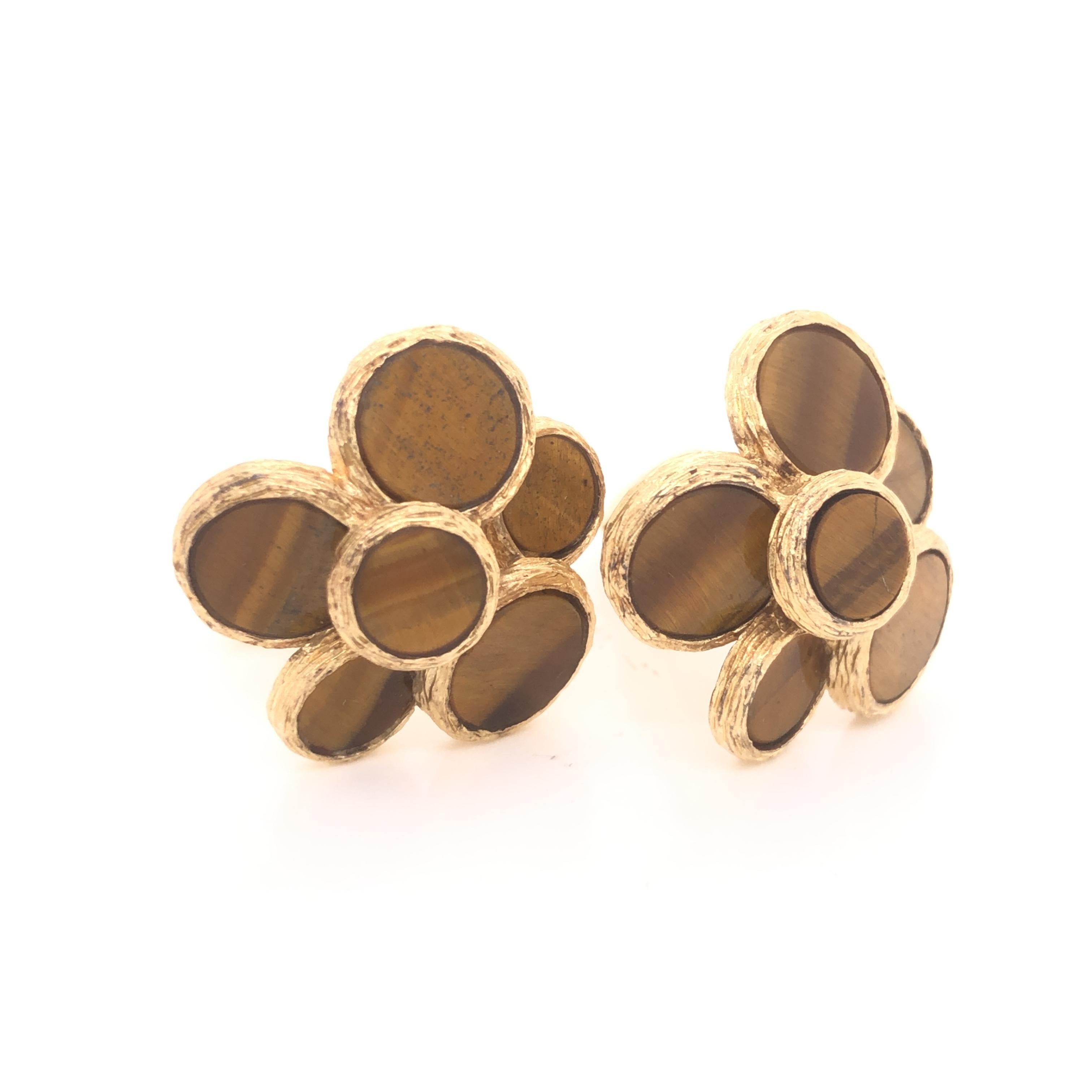 Amazing design from famed designer Aletto Brothers. This pair of cufflinks is crafted in 14k yellow gold. The pair is highlighted with beautiful tigers eye gemstones that are bezel set in a cluster pattern. The gemstones are set on different levels