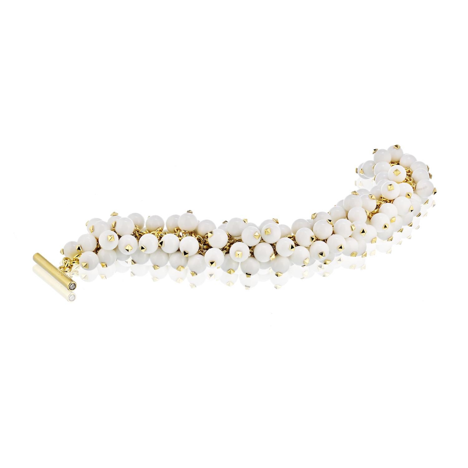 The bracelet is composed of articulated white agate beads, completed by a toggle clasp accented by full-cut diamonds weighing a total of approximately 0.10 carat, set in 18k gold, marked Aletto Brothers. Gross weight 85.60 grams.
Dimensions: 7-1/2