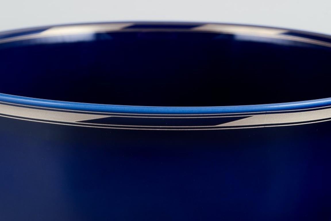 Danish Alev Siesbye for Royal Copenhagen. Large porcelain bowl with blue glaze For Sale