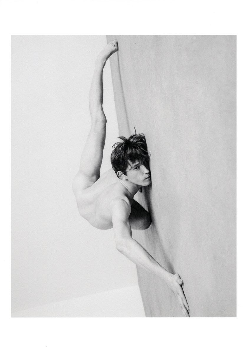 Vladimir K. (Young Male Nude in flexible, sensual position on floor) - Photograph by Alex Avgud