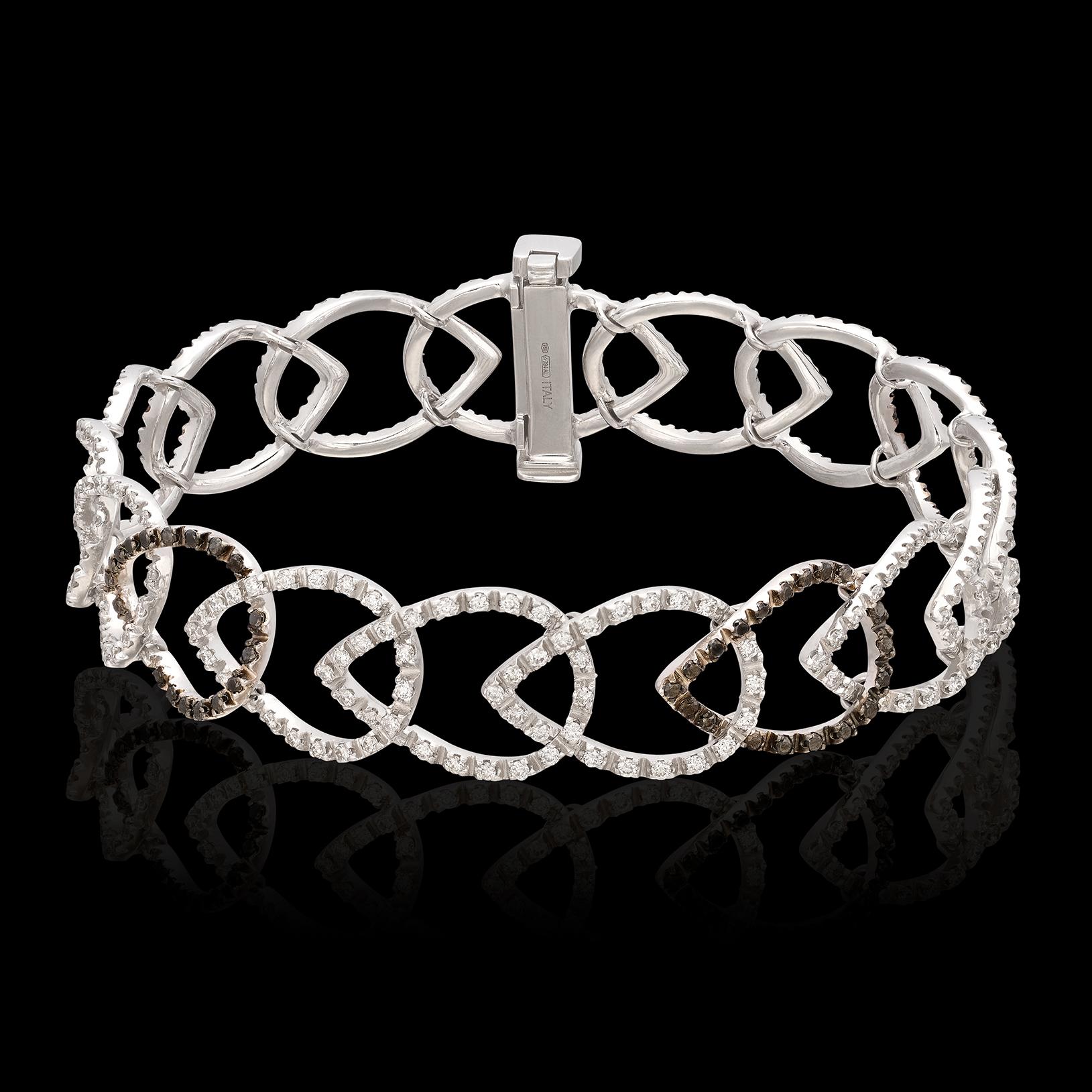 From the world of Italian design, this eye-catching bracelet is delicate and bold at the same time! Designed in 18k white gold, it featured interlocking tear-drop shaped links, set with round brilliant-cut diamonds weighing 1.92 carats and